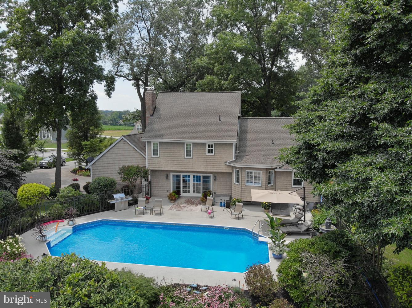 Classic 2 Story- Intown - Wooded Setting on 2/3 Acre- Family Room Walk-Out to InGround Pool - Formal Dining & Living Rooms - 4 Bed Rooms - Master Suite- 2 Car Attached Garage - Lower Level Excercise Room with Wet Bar - Many Technology Enhancements