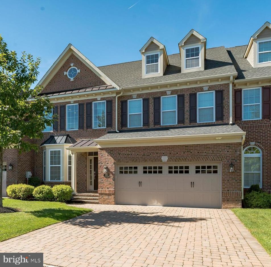 Welcome to Delancey Court, one of the premier 55+ Active Adult communities in the Bucks County area. The communities’ architectural style mimics the historic Philadelphia Neighborhoods featuring cobblestone driveways and brick exteriors. This "Paxton" model is upgraded throughout! The custom paver driveway and walkway lead to the covered porch and entry to this magnificent home. The two plus story formal living room provides a dramatic entry and features hardwood flooring, which can be found on the entire main level. The sunlit 2-story formal living room includes custom wainscot, crown and chair moldings, 6’ baseboards, recessed lighting and a turned staircase featuring metal spindles with a carpet runner and custom balusters which leads to the Upper Level. The formal dining room includes a tray ceiling with a custom crown molding inset, wall sconces, wainscot and chair rail and is open to the kitchen and family room areas. There is a bar with Quartz top and wine cooler to service the family room and kitchen, The gourmet kitchen boasts upgraded Quartz counters with subway glass tile backsplash, upgraded custom cabinetry with under mount and top lighting, all Viking upgraded stainless-steel appliances including a wall oven and microwave, a 6-burner gas cooktop with high velocity vented hood, dishwasher and an extra-large island with Quartz counters. The expansive island features additional double-sided cabinets and drawers for extra storage and seating and opens to the adjacent 2-story sun drenched large Family Room with gas fireplace, recess lighting, large windows and sound system is exquisite living space. The adjoining breakfast room features a glass door which accesses the expansive paver patio, custom retaining wall with professional plantings and fenced backyard and is a great place to relax or entertain. Outside the fenced area is an open yard with recently planted evergreens for additional privacy. First floor owner's suite complete with hardwood flooring, 2 large walk-in closets with custom professional organizers, 2 additional closets, tray ceiling, ceiling fan, recess lighting and custom moldings is polished and sophisticated. The luxurious bathroom complete with soaking tub, large walk in shower, marble counter tops double vanity and dressing area is gorgeous! A Powder Room, laundry room and large walk-in closet complete the main level of this beautifully appointed home. The grand circular staircase leads to the second level which features a spacious loft with balconies overlooking the 2 story living and family rooms, hardwood flooring enhances this large loft area with custom built cabinetry used as office space is perfect working at home. Two additional specious bedrooms, a hall bath with dual vanity, and a large storage closet complete the Upper Level. A staircase leads to the 3rd Level loft area which features large game room, rough in for additional bath and upgraded carpet is great additional space. Other amenities include a security system, custom window blinds, 2 car oversized garage, multi-zone HVAC, nest system, smart house technology, Sonos sound system, gas cooking, a paver/cobblestone driveway, extensive landscaping and much more! This home was designed for maximum comfort and luxury with minimal maintenance. Within close proximity to historic Newtown Boro with its shopping and dining, easy access to I-95 and the Pa & NJ turnpikes, this location makes traveling to Philadelphia, Princeton, New York and the New Jersey Shore an easy commute. The Delancey Court community features a private clubhouse, fitness center, indoor and outdoor pools, bocce court, conference room, game room and great room with a catering kitchen. This home is very well maintained and is move-in mint condition!