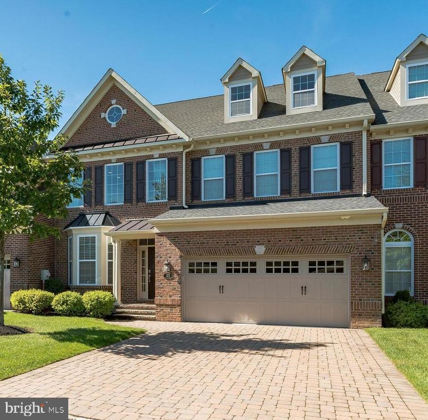 Welcome to Delancey Court, one of the premier 55+ Active Adult communities in the Bucks County area. The communities’ architectural style mimics the historic Philadelphia Neighborhoods featuring cobblestone driveways and brick exteriors. This  "Paxton"  model is upgraded throughout! The custom paver driveway and walkway lead to the covered porch and entry to this magnificent home. The two plus story formal living room provides a dramatic entry and features hardwood flooring, which can be found on the entire main level. The sunlit 2-story formal living room includes custom wainscot, crown and chair moldings, 6’ baseboards, recessed lighting and a turned staircase featuring metal spindles with a carpet runner and custom balusters which leads to the Upper Level. The formal dining room includes a tray ceiling with a custom crown molding inset, wall sconces, wainscot and chair rail and is open to the kitchen and family room areas.  There is a bar with Quartz top and wine cooler to service the family room and kitchen,  The gourmet kitchen boasts upgraded Quartz counters with subway glass tile backsplash, upgraded custom cabinetry with under mount and top lighting,  all Viking upgraded stainless-steel appliances including a wall oven and microwave, a 6-burner gas cooktop with high velocity vented hood,  dishwasher and an extra-large island with Quartz counters. The expansive island features additional double-sided cabinets and drawers for extra storage and seating and opens to the adjacent 2-story sun drenched  large Family Room with gas fireplace, recess lighting, large windows and sound system is exquisite living space.  The adjoining breakfast room features a glass door which accesses the expansive paver patio, custom retaining wall with professional plantings and fenced backyard and is a great place to relax or entertain. Outside the fenced area is an open yard with recently planted evergreens for additional privacy.  First floor owner's suite complete with hardwood flooring, 2 large walk-in closets with custom professional organizers, 2 additional closets, tray ceiling, ceiling fan, recess lighting and custom moldings is polished and sophisticated.  The luxurious bathroom complete with soaking tub, large walk in shower, marble counter tops double vanity and dressing area is gorgeous!  A Powder Room,  laundry room and large walk-in closet complete the main level of this beautifully appointed home. The grand circular staircase leads to the second level which features a spacious loft with balconies overlooking the 2 story living and family rooms, hardwood flooring enhances this large loft area with custom built cabinetry used as office space is perfect working at home. Two additional specious bedrooms, a hall bath with dual vanity, and a large storage closet complete the Upper Level. A staircase leads to the 3rd Level  loft area which features large game room, rough in for additional bath and upgraded carpet is great additional space. Other amenities include a security system, custom window blinds,  2 car oversized garage, multi-zone HVAC, nest system, smart house technology, Sonos sound system, gas cooking, a paver/cobblestone driveway, extensive landscaping and much more! This home was designed for maximum comfort and luxury with minimal maintenance. Within close proximity to historic Newtown Boro with its shopping and dining, easy access to I-95 and the Pa & NJ turnpikes, this location makes traveling to Philadelphia, Princeton, New York and the New Jersey Shore an easy commute. The Delancey Court community features a private clubhouse, fitness center, indoor and outdoor pools, bocce court, conference room, game room and great room with a catering kitchen. This home is very well maintained and is move-in mint condition!