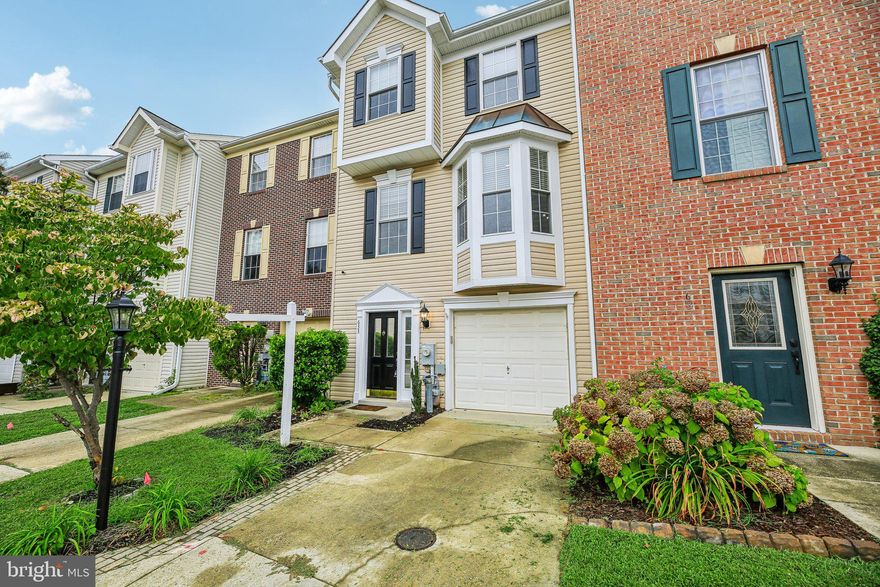 Price just reduced! Also for Rent for $3000/Mo.  Welcome to easy living on the Broadneck Peninsula! This three-level garage townhome blends comfort and flexibility with ample space to gather or unwind. The entry-level offers a versatile space—use it as a legal 4th bedroom, theater, office, or hobby room—plus a garage with extra storage for a workbench, gear - it even comes with a second fridge. Upstairs, the heart of the home is the stylish kitchen with granite counters, stainless steel appliances, including a Bosch dishwasher and newer refrigerator/freezer, and a movable island that makes entertaining effortless. A wall of pantry storage keeps everything organized, while the slider opens to a sunny deck and fenced yard—perfect for cookouts, gardening, or evenings under the stars. The open living and dining areas flow together, creating an inviting space for friends and family. Retreat upstairs to three bedrooms, including a serene owner’s suite with a walk-in closet and updated bath. Two additional bedrooms and a hall bath complete the home, offering space for everyone. Beyond the front door, enjoy an easy commute to major routes while being part of the coveted Broadneck community, home to Blue Ribbon Schools, parks, shops, and the Chesapeake Bay. And very close to the almost finished Broadneck Peninsula Trail!