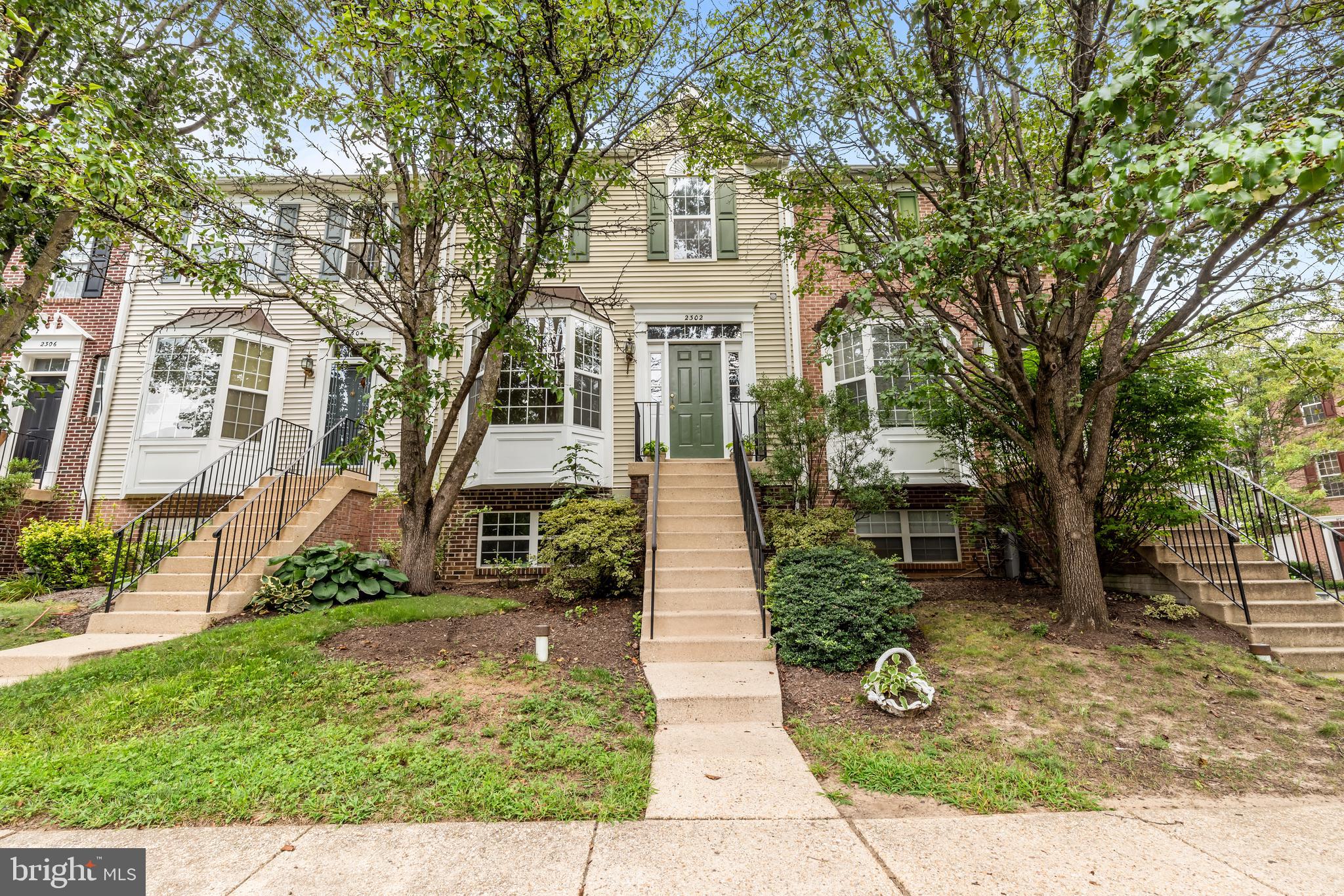 Stunning 4 Bedroom, 3.5 Bath townhome in sought after "The Knolls" community offers hardwood floors throughout and a wonderful floor plan. The main level has been freshly painted with spacious living room and Kitchen/Dining Room combo - the kitchen has large granite island and lots of cabinet space that flows out to the deck overlooking woods. The upper level has primary bedroom with vaulted ceiling and primary bath with shower and tub - all bedrooms have ceiling fans. The lower level consists of bedroom, full bath, laundry and entertaining family room with gas fireplace that leads to walkout patio and fenced yard. Great community amenities including 2 pools and super location to everything in Crofton!