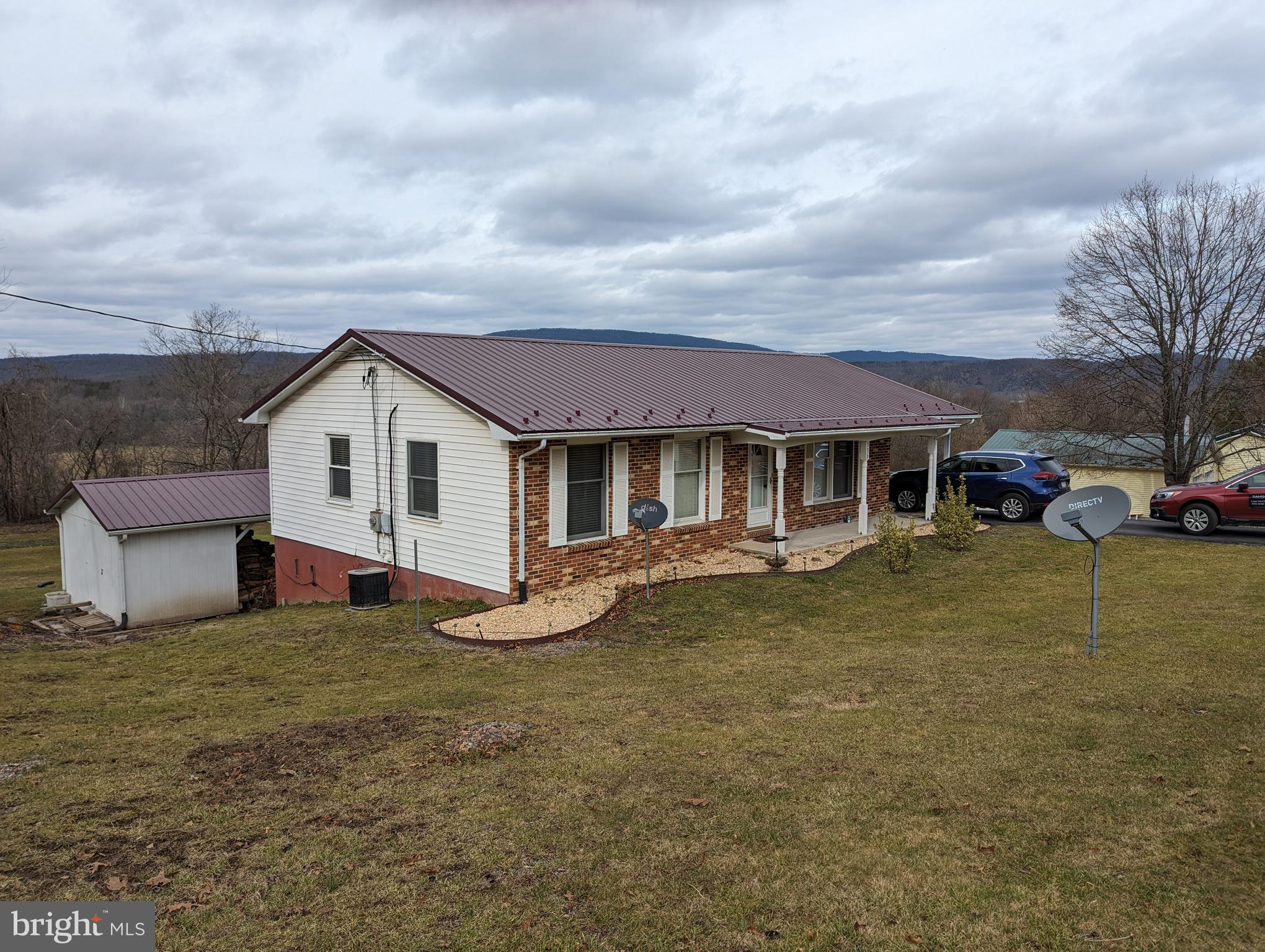 Charming 3 bedroom/2bathroom ranch home sitting on .83 acres. Beautiful mountain views right outside your back door. House features full walk out basement offers tons of storage, and space that could easily be finished to add additional living space. Keep your heating costs down while keeping the house warm and cozy with the wood stove, and a chimney liner was just recently installed. Side entrance from the carport gives easy access to the house while staying out of the weather. A second driveway goes around to the back for each access to basement. The large back yard has more than enough space and sunshine to have a garden, or you can just sit outside and enjoy the warm summer evenings while taking in the views.