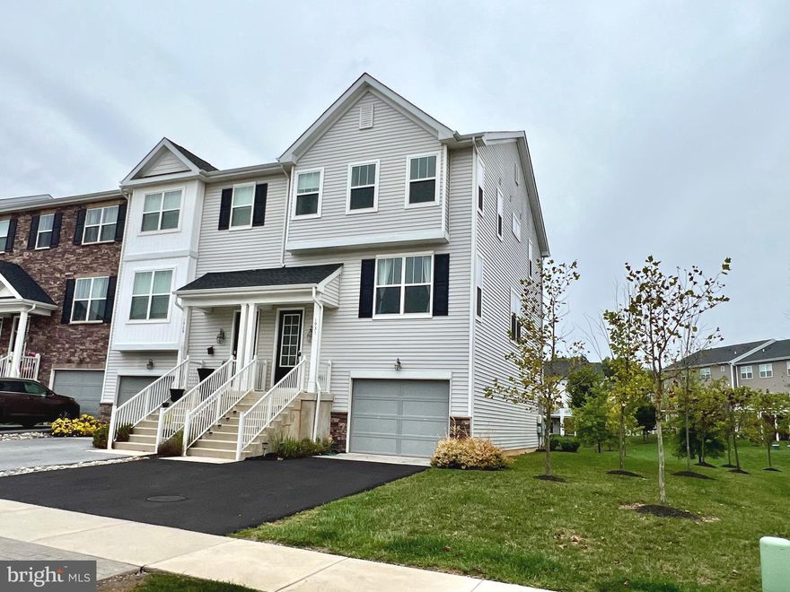 Available Now – 3BR/2.5BA End-Unit Townhome :This home is filled with natural light and modern upgrades, perfectly combining style and convenience. Just minutes from train stations, shopping, and major highways, it offers an easy lifestyle in a prime location. Enjoy hardwood floors and 9-foot ceilings throughout the main living spaces, an open-concept kitchen with granite counters and stainless steel appliances, plus a spacious deck for relaxing or entertaining. The finished lower level provides flexible space for a family room or office with direct access to a flat backyard.  Upstairs, the primary suite offers two walk-in closets, and two additional bedrooms share a full hall bath. A laundry closet is also conveniently located on this floor.  With an ELECTRIC VEHICLE  charger, reverse osmosis water system, and water softener already installed, this home is move-in ready!