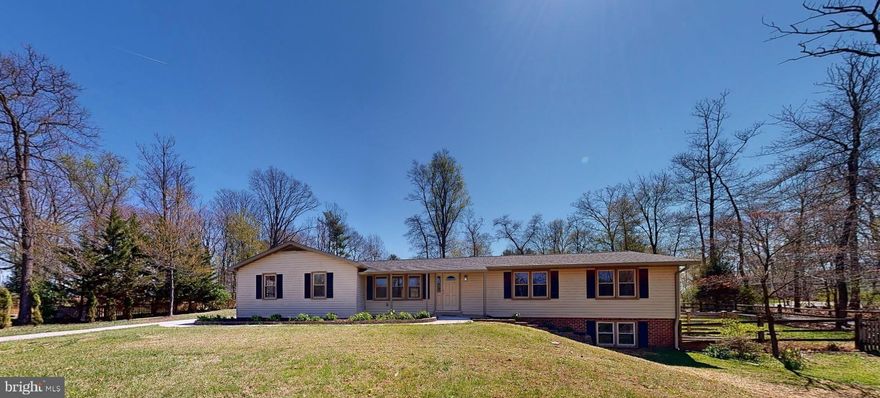 Welcome Home to this meticulously renovated 4-Bedroom & Den, 3-full-bath, 2 Fully FINISHED LEVEL residence that sits on a sprawling 1.31 acre lot, offering a perfect blend of contemporary luxury and serene country living. We invite you to come see this stunning modern transformation in gorgeous Howard County.  Some of the key features of this "like-new" home include:  Sophisticated Interior Finishes:
- Fully reimagined kitchen featuring NEW granite countertops and NEW stainless steel appliances - Three  bathrooms with NEW fixtures, valves & hardware, including an owner's en-suite rain shower with a built in seat & heat lamp -  a NEW hall bath with a modern dual-sink granite top vanity. NEW toilet, NEW fixtures and a lower-level guest suite with a BRAND NEW full bathroom with oversized shower. Interior includes:
- Bright, airy interior with over 44+ new LED recessed lights.
- A tasteful mix of NEW LVP flooring and  NEW plush bedroom carpeting.
- A NEW high-efficiency mini-split system for year-round comfort in the Lower Level
- Fresh Paint, NEW Interior Doors, NEW Laundry Room and Mud Room with sink and Folding Area
Extensive Exterior Upgrades:  - NEW 30 year shingle roof, NEW gutters with trim wrapped, NEW Downspouts and a NEW pressure treated wood rear 23 x 21 deck access off the dining area. NEW Side entrance retaining wall, A private, fenced-in yard with nice landscaping and 2 NEW retaining walls, one wood and one capped cinderblock. - NEW Hot Water Heater, NEW Well Pump Filters - An expanded, side-loading 2-car garage with extra wide "workshop" area --* EXTRA SPACE for parking for an RV or additional toys ** Prime Location:  Situated within the highly sought-after Howard County School District feeding to Glen ELG HS - Over an acre of land [ 1.31 acres ] providing rare privacy while remaining close to local amenities. House set back off the road. Open House Sunday 1-3 PM.