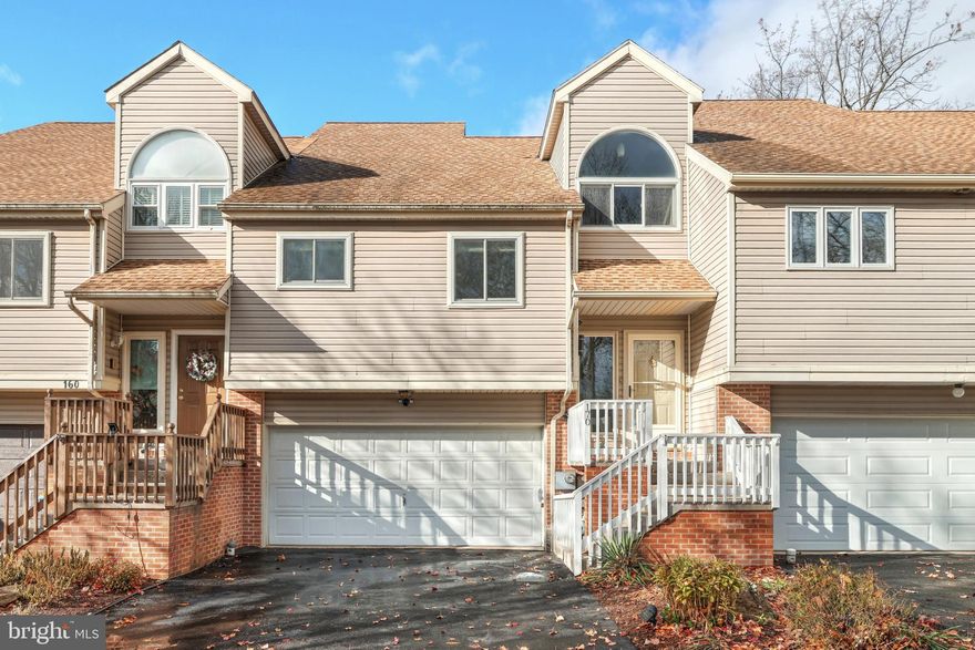 This awesome  2 bedroom, 3 full bath town home with low maintenance, low taxes and NO HOA fee's. Enjoy this split level with vaulted ceilings and skylights.  Large living room with stacked stone corner fireplace, leading out to an almost 300 square foot deck making your own private retreat. The kitchen has upgraded granite and tile back splash with a built in breakfast bar and brand new appliances, including washer & dryer. The spacious Master bedroom suite has a private master bath with a double vanity, his & her closets and sliding glass doors leading to the deck.  The upper level features another spacious guest room right beside a private bath and amazing loft overlooking the 2 story soaring ceilings. There is also a completely finished rec room, with a full bath and laundry.  In addition, the rec room has a 300 square foot private deck overlooking a wooded lot.  There is an oversize 2 car garage and a surprising amount of storage. A few upgrades include  Renewal by Anderson replacement windows, newer AC condensing unit, newer paint,  just to name a few items. Property is on a dead-end road with minimal traffic.