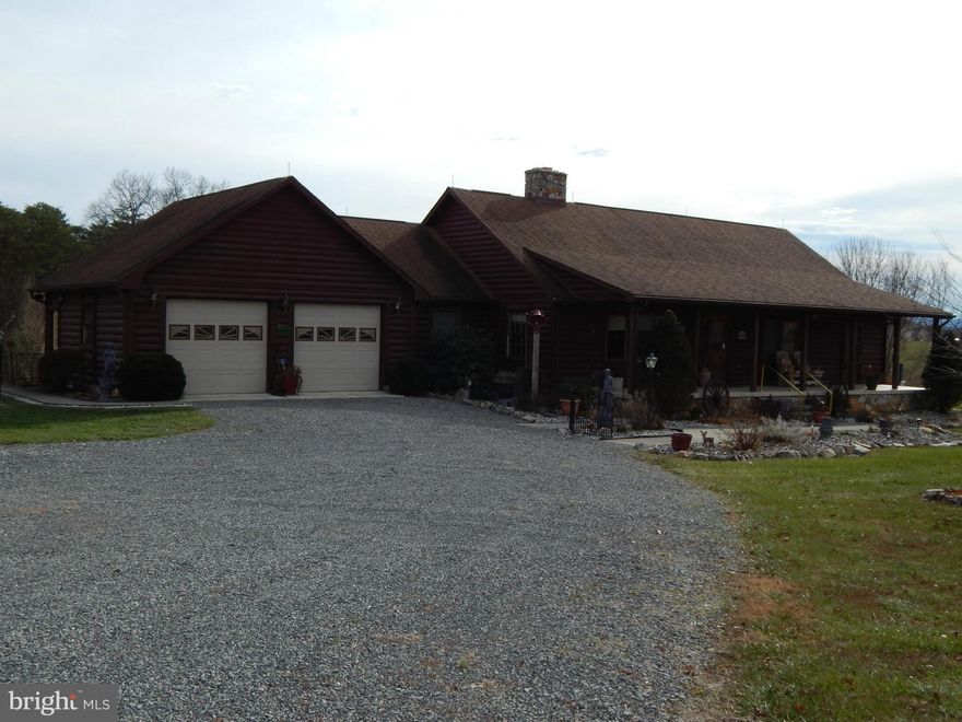 Log & Stone 3BR, 3BA contemporary rancher on 7.182 AC fronts Co. Rd.  Wood floors, WB FP, beautiful log beams w/ cathedral ceilings.  Recently updated w/ SS appliances, granite counter top & Geo-Thermal. Antique cook stove.  2 car attached garage + det. garage holds 4 cars w/ additional hay storage.  Full bsmt. w/ fenced yeard. 2 stall barn & fenced for 1 horse. Front porch + screened back deck.