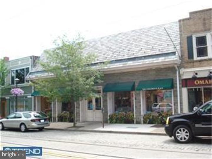 This premier commercial property is prominently located on Germantown Avenue in the center of Chestnut Hill's business district. The masonry one-story 5,000 SF retail building with handsome stone facade, slate mansard roof, and large display windows, is mostly open span with 12 feet ceilings and rear access to a large community parking lot. This assemblage of four contiguous parcels comprising a half acre of "top-of-hill" land is improved with a 70+ car parking lot presently leased to the CHCA Parking Foundation and accessed via W. Highland Avenue. The retail building is not encumbered by leases. The four properties are: 8512-16 Germantown Ave, 8518 R Germantown Ave, and 25 & 27 W. Highland Ave. Property is in a Business Improvement District.