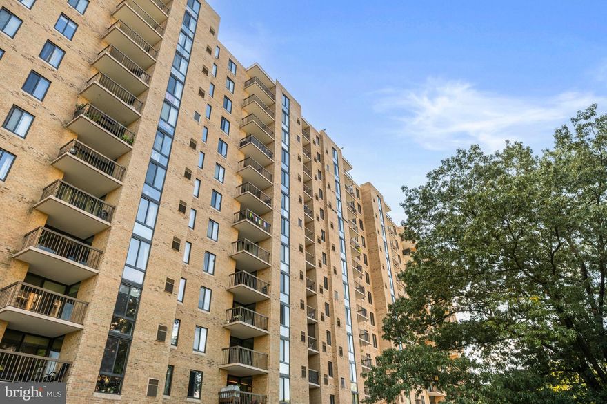 Experience the perfect blend of space and convenience in this 856 sq ft, 1-bedroom, 1-bath condo with a versatile den located in the heart of Arlington. This bright and freshly painted unit boasts major recent updates, including a brand new in-unit washer/dryer (2025) and a newer HVAC system (2022) for worry-free comfort. Enjoy hardwood floors, an upgraded kitchen with granite counters and stainless steel appliances, and a separate dining space. The private den is perfect for a home office or flex space. Step out onto the huge balcony for outdoor relaxation. With two assigned parking spaces (50 & 314), and an extra-large storage closet in the unit, everything you need is here. Live an amenity-rich life with a pool, fitness center, tennis courts, and 24-hour front desk. Just minutes from Shirlington, DC, and major commuting routes like 395, with direct access to Four Mile Run and W&OD Trails. This is Arlington living at its best!