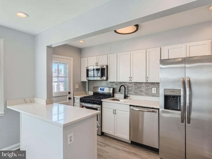 NEW PRICE!!!!! Welcome Home! Exquisite renovation features an updated kitchen w/ island & stainless steel appliances, updated laminate flooring on the main and lower levels, freshly painted throughout, walk out from your kitchen to a fully fenced in backyard w/ shed (can also be converted to a parking pad for off-street parking), open concept as you enter into your living room w/ separate dining area, lower level features an additional bedroom & full bathroom, and a separate laundry area, as well as rec room. Walk out from your basement to your landscaped yard! Upper level features two spacious bedrooms, and updated full bathroom! The upgrades are endless! Request a private exclusive tour with one of our agents today before it is gone!