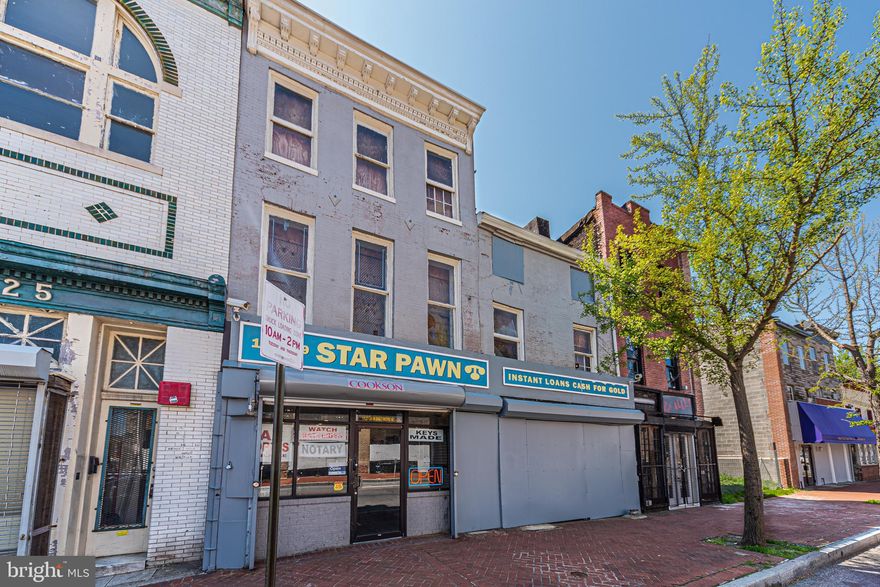 DEVELOPMENT OPPORTUNITY!  LARGE COMMERCIAL SHELL IN HOLLINS MARKET!  Property includes both 1127 & 1129 W. Baltimore St. and the main level has a large retail space & office.  The upper level was previously an apartment.  Located close to UMMC, downtown Baltimore, stadiums, & major roadways! Property needs complete renovation and is sold As-Is!