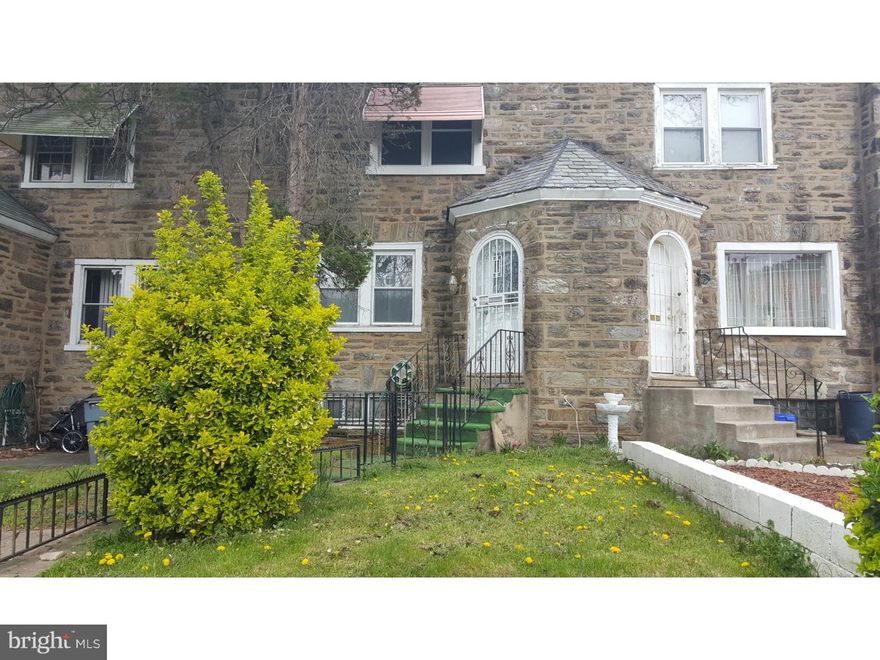 Investors! Easy flip or hold. Nice street. One of the larger stone front rows in the area. One block from LaSalle University.