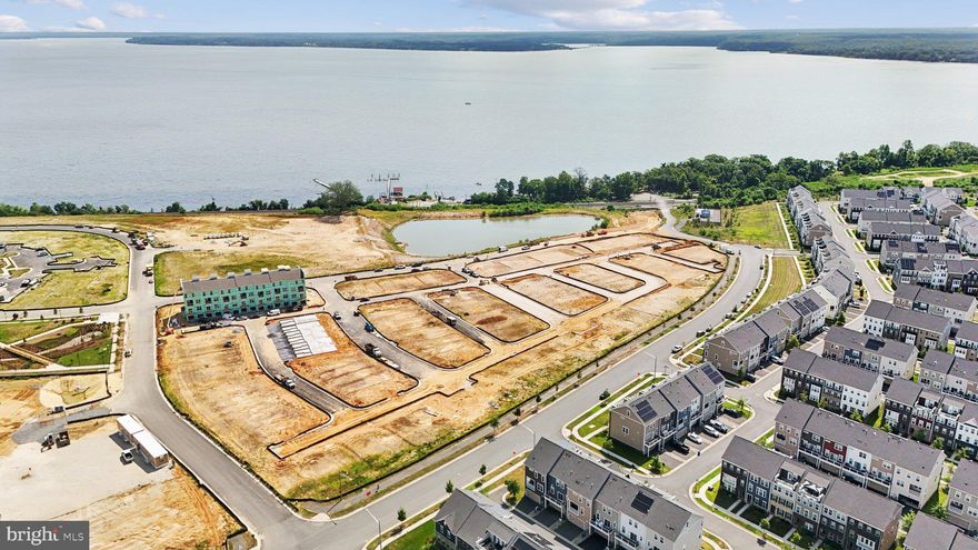 Welcome to this brand new construction home ideally situated in the heart of Potomac Shores, and along the banks of the Potomac River. Just a short walk to the fitness center, three resort style pools, miles of scenic walking trails, Northern Virginia's only public Jack Nicklaus Signature Golf Course, and the incoming Potomac Shores VRE station with day-to-night Town Center offering even more convenience and charm. On the entry level, discover a bright kitchen that features designer enhancements including stainless steel appliances, a deep farmhouse style sink, sleek quartz countertops, and gorgeous backsplash tile. With a breakfast bar that opens into the dining area, this floorplan is ideal for entertaining! Natural light flows seamlessly in from the adjacent living room through it's stunning expansive windows. Upstairs, discover the oversized primary bedroom, it's two walk-in closets, and a contemporary en suite bathroom with double sink vanities and a step-in shower. Down the hall you’ll find the second tasteful full bathroom, and additional bedroom for guests or a bright office space. The open loft or upstairs living area features private balcony access and space to create, exercise, read, write, or entertain. On the rear of the home, the one-car garage and driveway provide you with plenty of space for storage and parking. Conveniently located to quick access of I 95, US 1, route 234, DC OmniRide commuter lot, Fort Belvoir and Quantico. Schedule your tour today and see why living in Potomac Shores is more than just a home—it’s a lifestyle. If you’re seeking walkability, elegance, and lifestyle, this is what you’ve been waiting for! Receive up to $25,000 in closing cost assistance for a limited time. *Photos are of a similar home.*