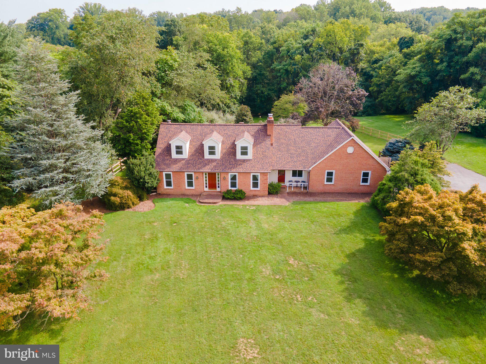 This charming brick Cape Cod home sits back off the quite road on 2.01 Acres in the sought after Willowdale subdivision. This home features 3 spacious bedrooms, 3 full baths, 2 car garage, fenced in back yard that backs to common area with trees, two porches in the front , back patio and a separately fenced in side patio. The eat-in kitchen has a brick fireplace, an island with quartz counter top and solid wood cabinets. There is a main level bedroom with a wood burning stove and a main level full bathroom, for main level living! This home is move in ready with a brand new roof, brand new carpet through out, fresh paint inside and fresh paint on the outside. Come see if this property is the home that is meant to be yours! Check in tours, click on the link to this properties own unbranded website with walk through videos, inner active floor plans, and more. Call your buyers' agent to schedule a showing!