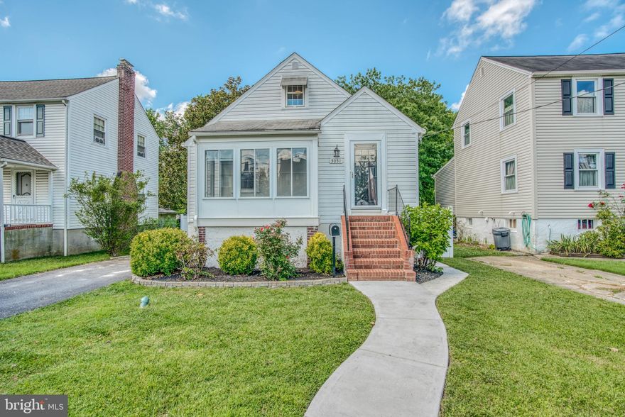 Wonderful recently renovated home on quiet street in heart of Parkville! Four bedrooms and three full baths, one on each level. Large open floor plan on main floor with super high-end gourmet kitchen. First floor features gorgeous hardwood floors and lots of space. Step off the main door to a sunroom on the front of the house. Two nice sized bedrooms on the first floor and the full bath is just a delight! Off the chef's dream kitchen is another large sunroom, this time in the rear, with shaded private views. Great spot to enjoy the morning coffee or evening cocktail. Upper floor has spacious owner's suite with more hardwoods, high end tile and a super owner's bath with a large closet. Downstairs, it's a fantastic basement with wet bar to enjoy times with friends, featuring a large potential 4th bedroom/office and a nice laundry room. Stairs from the back of basement lead out to rear yard. Back yard has a brand new composite deck with shade and privacy. You won't find many more private backyards in this area of Parkville! Move in and enjoy this upscale oasis!