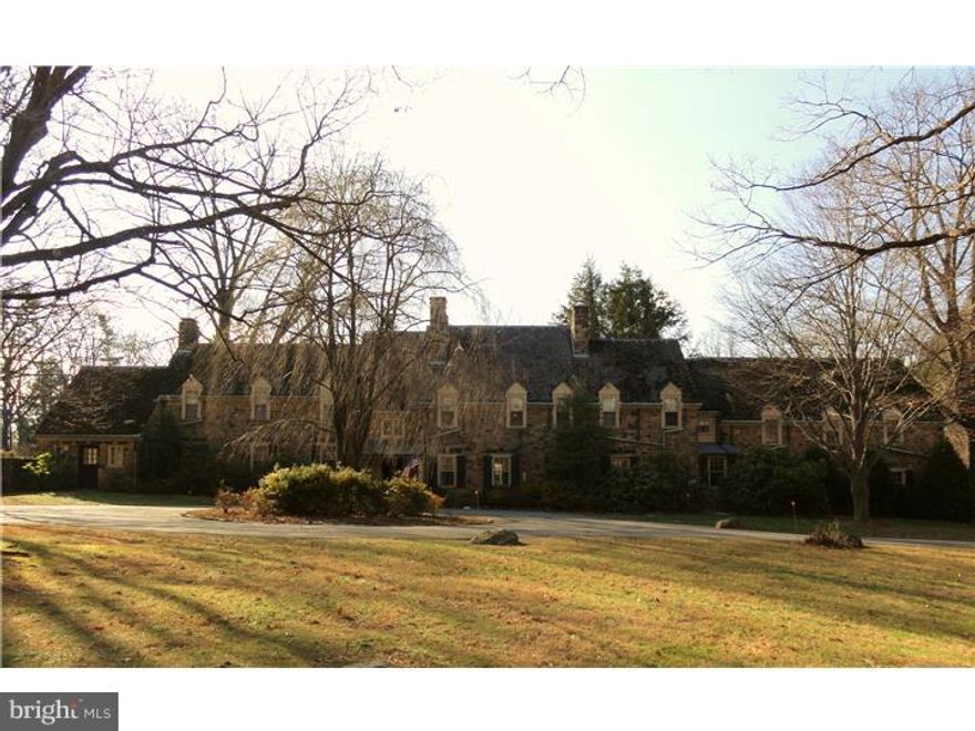 A sweeping private drive off Darby Paoli Rd leads to a magnificent solid stone colonial with 6 bedrooms, 6.2 baths and is situated on 13.5 lush acres. Built in 193l, Sunnycroft is a very special place reminiscent of a by-gone era. Old world craftsmanship is evident throughout the home and in the stone patios and terraces, as well as, the classic stone walls accenting the many gardens surrounding the property. Features include a circular drive, random width pegged hardwood flooring and architectural details throughout the spacious formal rooms, 7 fireplaces, a Gourmet Kitchen, a first floor library, a master suite with his and her dressing rooms and his and her baths, 3 additional bedrooms each with a private bath, a 2 bedroom in-law or au-pair suite with family room, kitchen, and  bath - complete with private outside entrance, a 2 bedroom guest cottage with a greenhouse, a tennis court, an in-ground pool, and courtyards.