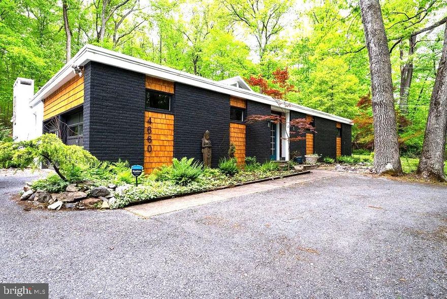 Nestled on a sprawling 2.65-acre lot in Exeter Township, this unique contemporary ranch-style home offers distinctive one-floor living with the main entrance being a stunning indoor courtyard, an architectural centerpiece that gracefully connects the surrounding wings of the home. 

This home features a bright formal living room with hardwood flooring and a charming wood-burning fireplace, which continues seamlessly into the spacious formal dining room—ideal for entertaining and special gatherings. Leading into the sun-filled modern kitchen with a skylight and large windows overlooking the backyard. Nearby, a warm and inviting second living room serves as the perfect everyday retreat, complete with a wood-burning fireplace, dramatic stone accent wall, built-in 65" television, and custom bookshelves.

The private bedroom wing includes four bedrooms, highlighted by a tranquil primary suite featuring an entire wall of large windows overlooking the serene backyard. An updated full private bathroom completes this relaxing owner’s retreat.

 A circular driveway and side-entry garage further enhance the home’s impressive curb appeal.

Thoughtfully designed with character and functionality in mind, this one-of-a-kind residence blends architectural charm, spacious living, and a private wooded setting just minutes from major highways, shopping, dining, and everyday conveniences.