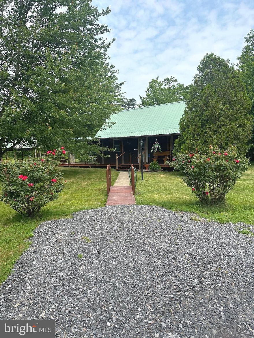 Country Rustic Charm at its finest!  This adorable cabin in nestled in the woods, only a few miles from Whitetail Resort.  Abundant wildlife right in your back yard.  Cabin has an open concept living with a loft and one bedroom and a half bath (toilet and sink).  Prior owners were off grid living and had an outdoor shower!  Property does have a well and a holding tank.  Sitting on just over 5 acres this is your recreation dream!  Perfect Airbnb, get away, or home.  Two sheds, picnic area with hard wired propane to the grill.  This is a must see!  Listing Agent is related to Sellers.  Property is an Estate.