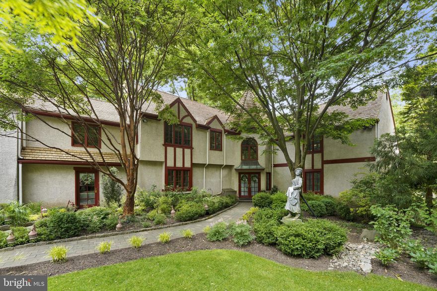 Located on one of Gladwyne's most desirable streets, this custom-designed residence offers a blend of elegance and comfort. As you enter the grand two-story foyer, you're immediately welcomed into a living room accentuated by a soaring ceiling and stone wall fireplace. The dining room, enhanced by a stone wall accent and deck access, seamlessly connects to a butler's pantry.

An expansive two story great room features hardwood floors, a gas fireplace, and brightened by natural light from an abundance of windows. The kitchen is a chef's paradise, with a custom granite-topped island, Corian countertops, a double oven, cooktop, and plentiful cabinet storage. A nearby breakfast area, complete with a fireplace, offers the perfect spot for casual dining or relaxation.

On the main level, you'll find the primary bedroom suite, complete with vaulted ceilings, a private bathroom with shower and access to a private deck. An elegant spiral staircase ascends to the upper level of the suite, accessing a second bathroom with a large soaking tub, vanity, and spacious closet.

The second floor comprises three additional bedrooms, one with an ensuite and two sharing a Jack-and-Jill bathroom. Over the library, a sitting area and two bedrooms with a shared bathroom provide an ideal space for guests or extra bedrooms.

The lower level opens to a large recreation room, a full bathroom, a storage area, and two flexible rooms which could be utilized as bedrooms or offices. Enhancing the property's allure is a hard tru tennis court nestled within a park-like setting. Additional amenities include a detached studio, abundant parking, and multiple decks and patios. 

The property is conveniently located within walking distance to the village of Gladwyne and in close proximity to Center City, Phila International Airport, King of Prussia.  

Please note: **all escrow deposit checks must comply with office policy by being certified funds.** Also, the refrigerator depicted in the kitchen photos has been replaced, and the furniture in the images represents virtual staging.