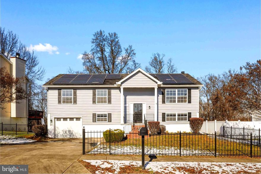 Beautifully updated split-foyer home situated on a generous, flat 0.33-acre lot in Oxon Hill. This two-level residence offers 4 bedrooms and 3 full bathrooms with a functional and flexible layout. The upper level features a bright living room with high vaulted ceilings, dining area with sliding glass doors leading to the rear deck, and an updated kitchen with new appliances. Three bedrooms and two full baths complete the main level, enhanced by new luxury vinyl plank flooring throughout.

The lower level includes a spacious family/recreation room with walk-out access to the backyard, a fourth bedroom, a full bathroom, laundry area, and mechanical closet. Additional highlights include a one-car garage with driveway parking, excellent curb appeal, double-pane vinyl windows, an updated 200-amp electrical panel, and a HVAC system replaced in 2017. The roof is in good condition and equipped with Tesla solar panels. Outdoor features include a deck, storage shed, and a large, level backyard ideal for entertaining or future customization.

Conveniently located near major commuter routes, shopping, and amenities. A solid opportunity offering space, updates, and long-term value.