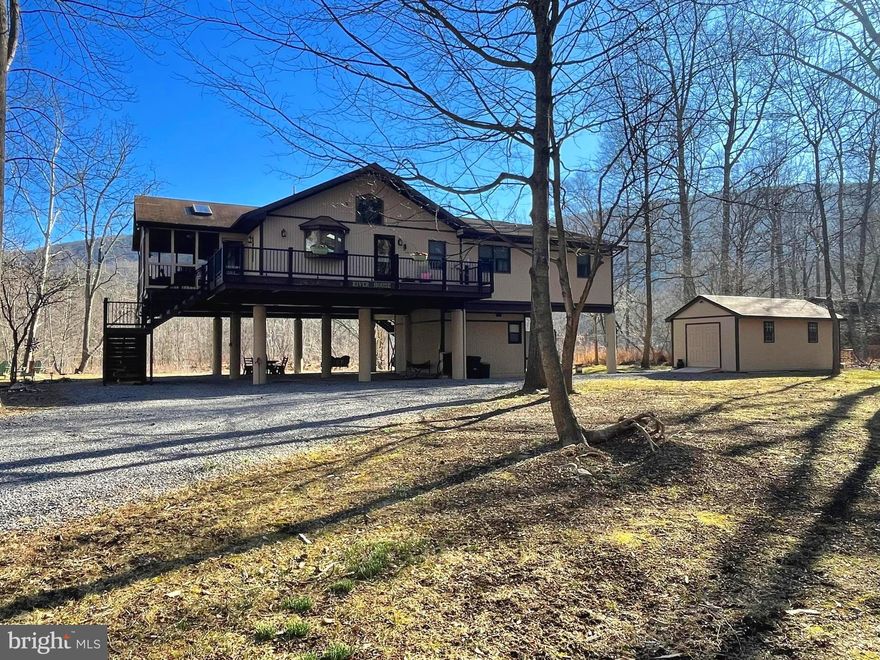 Offer deadline 4pm Wednesday 2/21/24. This home puts the wow in wow factor! Welcome to 295 Running Waters Way! A RARE river front property in beautiful Great Cacapon! Perfectly situated on 2+ acres with 200ft of river frontage this immaculate turn key 2,100 sqft property boast 3 bedrooms, each with there own full bathroom on the main level! Need another bedroom? No problem, head to the lower level to find an additional guest suite with a half bath and kitchenette!  After a day spent fishing, floating , or kayaking step in to the brand new outdoor shower and rinse you worries away! Whether your sitting in the screened in porch or the new Trex deck you can not miss the peaceful sites of mountains and the rolling sound of the Cacapon River! Make this home your permanent residence, escape from the city life, or an Airbnb! Only 2hrs from DC and 45 minutes from Winchester VA! This home could be yours to enjoy by spring! Do not miss out schedule your appointment today!