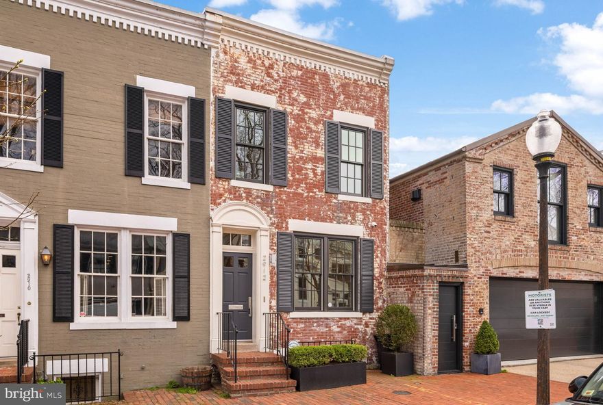Stunningly Renovated 3BR/3BA Townhome in Historic Georgetown – 2912 Dumbarton St NW, Washington, DC

Nestled on a picturesque, tree-lined street in the best part of Georgetown, this exquisitely renovated 3-bedroom, 3-bath townhome blends historic charm with modern luxury. Step inside to find an open, light-filled floor plan that was recently refined by Richard Williams Architects and Tom Glass of Glass Construction, featuring elegant hardwood floors and designer finishes throughout. The gourmet kitchen features high-end appliances, marble countertops, and custom cabinetry.

The spacious primary suite offers a spa-like en-suite bath, while two additional bedrooms provide comfort and versatility. A private outdoor patio with a small pond and fountain invites relaxation or al fresco dining. With updated systems, sophisticated design, and an unbeatable location, this home is a rare find. Enjoy the best of Georgetown— Scheele's and Streets Markets, Rose Park, and the shops and restaurants on M Street and Wisconsin Avenue are all steps away. Garage parking available for rent.

Don't miss this exceptional opportunity to own a piece of Georgetown’s timeless elegance! Schedule your private tour today.