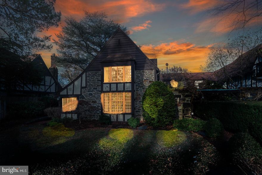 Welcome to 638 Loves Lane, a charming semi-detached single-family home nestled in the heart of the historic community known as the English Village in Wynnewood. This exquisite residence offers nearly 3,000 square feet of living space, and features four spacious bedrooms with two and a half bathrooms.

Step inside the welcoming foyer and admire the original antique tile floors, thick walls with deep sills and wavy leaded glass windows that set the tone of elegance and classic detail found throughout this English Village home. The beamed and sunny living room boasts a lovely wood burning stone fireplace, warm random width hardwood floors with a cozy, timbered nook. Through classic leaded glass French doors is an enclosed, conditioned sunporch that could make an ideal office or study and has  a convenient outside entrance to the brick patio. The light filled formal dining room is located  off the foyer,  and features a wall of windows & French doors, the signature beamed ceiling and an original 1920's built in vaisselier.  Between the dining room and kitchen is a comfortable sitting room, with garage and basement access.  The  well equipped cherry kitchen has generous cabinet space, corian counter tops and an open pass through to the sitting room, an ideal set up for entertaining. Dry and unfinished, the basement includes convenient storage, laundry facilities and a walk up stairway to the side patio. Heading upstairs via the wide planked turned stairway, the  original English detailed trim, beams and stained glass light fixtures create a delightful ambiance  unique to the English Village.  There are three hall closets off the main hallway enroute to the primary suite.  The spacious light filled primary bedroom includes another cozy beamed nook and is adjacent to the white tiled master bathroom. Off the primary bathroom a doorway connects to a second bedroom with a cedar closet and pull down stairs to a full sized fully floored attic. The third bedroom shares a bath with the forth bedroom, which is beamed, and well proportioned.     

The home is adorned with beautiful English styled hardwood timbers, inlaid inside and out. Original leaded glass windows, Mercer tiles, and random width pegged Oak floors are among the historically significant features of 638 Loves Lane. The living spaces are complemented by central air conditioning and heating, ensuring comfort year-round. Beautifully hardscaped with lovely aged brick and flagstone patios, the fully fenced property includes a nicely landscaped front yard. There is an attached garage with off street parking, providing both security and ease of access. 

In all, 638 Loves Lane combines historic & classic charm with modern amenities, making it a perfect choice for those seeking comfort and style in this desirable Main Line location.