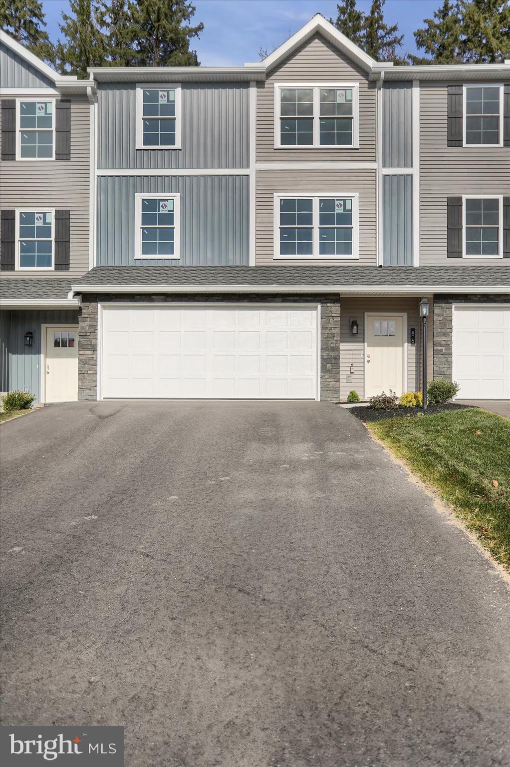 Lots of living can be done when the lawn maintenance and snow removal are done for you. Enjoy this 3 BR, 2.25 bath townhouse in the areas premier development: Monroe Manor. Brand new and soon ready for you. The 1st floor laundry and two car integral garage make this home convenient living. Sq ft data is from builder drawings. Lot Size from builder survey.