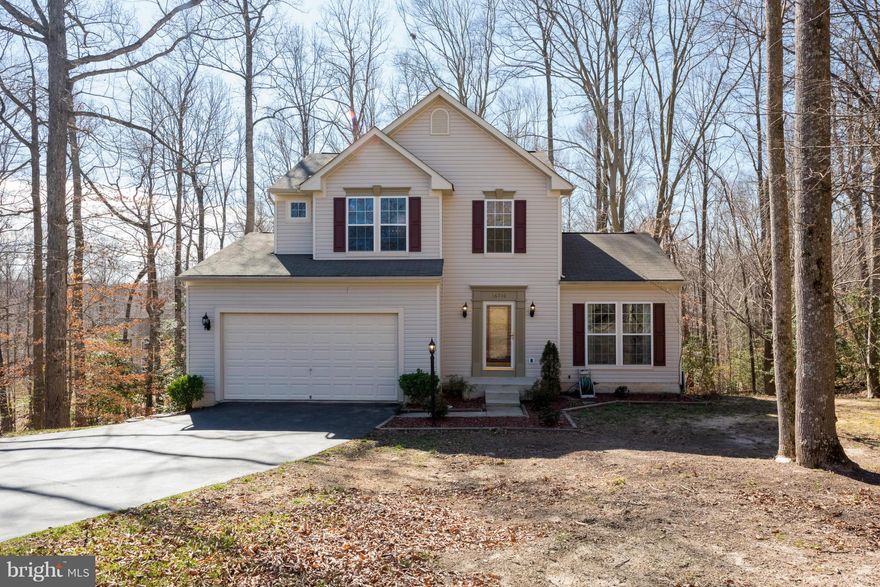 Spacious home priced right!  This house has it all.  Colonial home on private cul-de-sac with open floor plan. Bright, airy kitchen opens to large family room with fireplace.   Formal living room and dining room, hardwood floors and partially finished basement. Enjoy summers on your private deck overlooking large forested area.  Easy commute to Andrews, DC or Pax River.