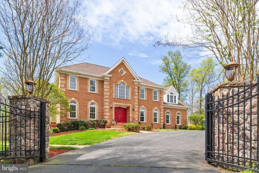 Indulge in the privacy and grandeur of this custom-built Colonial estate in desirable Fairfax. The expansive lot sets the stage for this exceptional home, offering a secluded haven while remaining close to all the conveniences Fairfax has to offer.

Step inside the main level and be greeted by a flowing floorplan designed to impress. Soaring 10ft ceilings create a sense of spaciousness, accentuated by a two-story custom painted foyer with a gleaming chandelier and marble floors. A curved grand staircase with elegant railings guides you upwards, while lovely arched doorways throughout add a touch of timeless charm. Unwind in the inviting library, perfect for a quiet retreat. Prepare culinary delights in the gourmet kitchen, featuring modern stainless steel appliances, ample counter space, and a breakfast area for casual dining. Enjoy cozy evenings by the fireplace in the family room, conveniently located just off the kitchen. Refinishing original hardwoods throughout the main level add warmth and character to the space.

Head upstairs and discover a haven for relaxation. Four well-appointed bedrooms offer ample space for family and guests. The luxurious primary suite boasts an ensuite bathroom, while an adjacent bedroom also features its own private bath. An oversized bedroom above the garage provides additional versatility - use it as a second-floor family room, office space, prayer room, or exercise area, depending on your needs. Each bathroom on this level is a full bath for added convenience.

The finished basement expands your living and entertainment options. Enjoy movie nights or host game days in the spacious family room, complete with a cozy stone fireplace. A wet bar featuring a sink, counter, and cabinets provides a convenient refreshment station, while a third refrigerator with a freezer ensures you have ample storage for all your needs. A spacious fifth bedroom with bay windows offers a tranquil retreat, while a full bath with double entry provides flexibility.  An additional large open space awaits your vision - transform it into an exercise room, office space, a playroom, a game room, or anything your heart desires. Ample storage and shelving keep things organized, and a walkout leads you directly to the oversized fenced-in backyard.

Venture outside and discover the true gem of this property. The large, gated circular driveway with dual entrances provides ample parking and a grand entrance, while the privacy fence allows you to create your own personal oasis. Relax on the spacious deck and enjoy the fresh air, or unwind on the screened-in porch, offering a perfect spot to escape the summer heat.

This prestigious address places you within a friendly and established neighborhood, perfect for raising a family or enjoying a peaceful lifestyle. The surrounding location of Fairfax offers easy access to top-rated schools, an abundance of shopping and dining options, and convenient commuter routes for exploring all that Northern Virginia has to offer. Minutes from Fairfax County Pkwy, Braddock Rd., Rt. 28, you'll enjoy the benefits of a vibrant community while maintaining your private sanctuary. Don't miss out on this exceptional opportunity to own a piece of paradise!