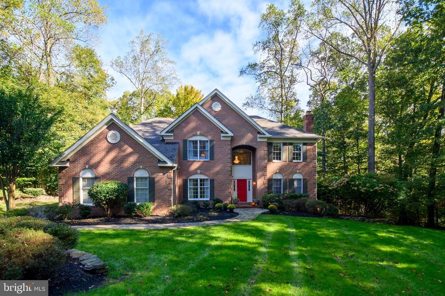 Welcome to this elegant home tucked away on over 1.70 acres in a secluded and private setting surrounded by lush greenery.  The house features 5 bedrooms and 4.5 baths.  The foyer is grand and welcoming with a spiral staircase and marble flooring and is sure to impress! The living room is bright with a gas fireplace, elegant moldings, and hardwood flooring.  The dining room has lots of windows, lovely crown molding and hardwood flooring.  The home office on the main level is perfect for those who work from home or need a quiet space to read or study.   The laundry/mud room has an upgraded steam front-loading washer and upgraded dryer - both sit on pedestals for extra storage.  The kitchen is beautiful and spacious with recently upgraded appliances, tons of counter and cabinet space, island seating for 4, spacious dining area, pantry, built-in desk and hardwood flooring.  The French doors from the kitchen open to a deck which overlooks a private lush setting.  There is a beautiful family room off the kitchen with a full two-story wall-of-windows overlooking a gorgeous, treed lot that backs to a nature preserve.  The high ceiling showcases the stone fireplace with a heat-efficient gas insert that will keep you warm and cozy on a winter's night.  The back staircase from the family room leads you to the upper level.   The very spacious owner's retreat features large closets, sitting area, lots of windows, double vanities, soaking tub, newly designed separate shower and linen closet.  There is a guest bedroom with private bath and two additional bedrooms connected with a Jack-and-Jill bath.  The fabulous walk-out-lower-level is the perfect space for entertaining, including a big recreation room, a movie/media room with surround-sound, bedroom, full bath and a walk-out onto your private vacation-like oasis.  Take a short walk from the patio to the gorgeous heated in-ground pool with spa which is surrounded by a spacious deck with plenty of room for lounging and sunbathing.  There is plenty of parking including a three-car-side-load garage.  This very special home is perfect for anyone looking to escape the hustle and bustle of city life and is ideally located in a community of fine homes with convenient proximity to Washington, DC, Baltimore & Northern Virgina, and three major airports and can be yours just in time for the holidays!