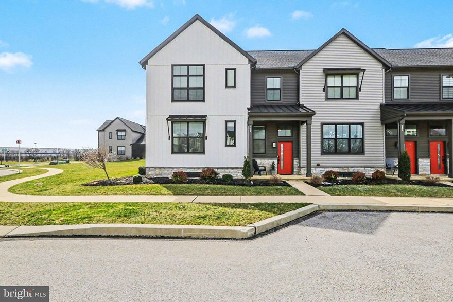 Welcome to the meticulously maintained end-of-row townhome, in the highly popular community of Legacy Park, Madison Court. As you step in the front door, you are greeted with an open floorplan that is perfect for entraining. The Great Room has LVP Flooring and an inviting Electric Fireplace, a perfect addition for curling up on the sofa for a nap or with your favorite book or movie. Open to the Dining Area, with LVP Flooring, and well appointed Kitchen, with Stainless Appliances ( which all convey), Large Island, Quartz Countertops, Tile Backsplash, Coffee Bar, LVP Flooring and it flows nicely to the Screened-In-Porch. Just down the hall, you will find the Powder Room with LVP Flooring and a Pedestal Sink, a very convenient  Laundry Room ( both Electric Dryer and Washer Convey), followed by a sizable Mud Room with built-in-shelving and cubbies and then to the  Over-Sized two car Garage access. The Owners Suite is just off to your left, and offers warm carpeting, a large Walk-In-Closet, and the Ensuite with LVT Flooring, Over sized Walk-In Tile Shower and Double-Sink Cultured-Marble Vanity. The second floor boasts a large carpeted Loft Area, two nicely sized carpeted Bedrooms and the Main Bath. The Unfinished Basement holds endless possibilities. All of this on your oversized corner lot, making those evenings on the Porch even more enjoyable. A fence, once approved, can also be added for more privacy.  Don't miss this Beauty! Schedule your showing today.