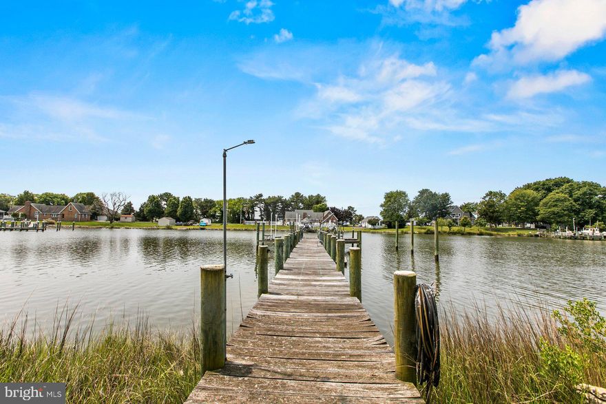 Amazing opportunity to own a charming historic farmhouse on prime waterfront in beautiful Avenue! This home has been partially updated/beautified and has amazing potential as a dreamy primary residence or charming vacation rental. This lovely 3 bedroom, 2 full bath home is waiting for someone to take it to the next level! Enjoy gorgeous sunsets from the screened in back porch or back deck, and the waterfront lifestyle is possible with the pier, boat lift and jetski lift right out your back door. Large 1.75 acre lot, shed and workshop as well. Large country kitchen with pantry and large utility room off the kitchen. Hardwood floors in some rooms,  updated bathrooms and gorgeous views of the creek  from several rooms. Come tour this beautiful property today!