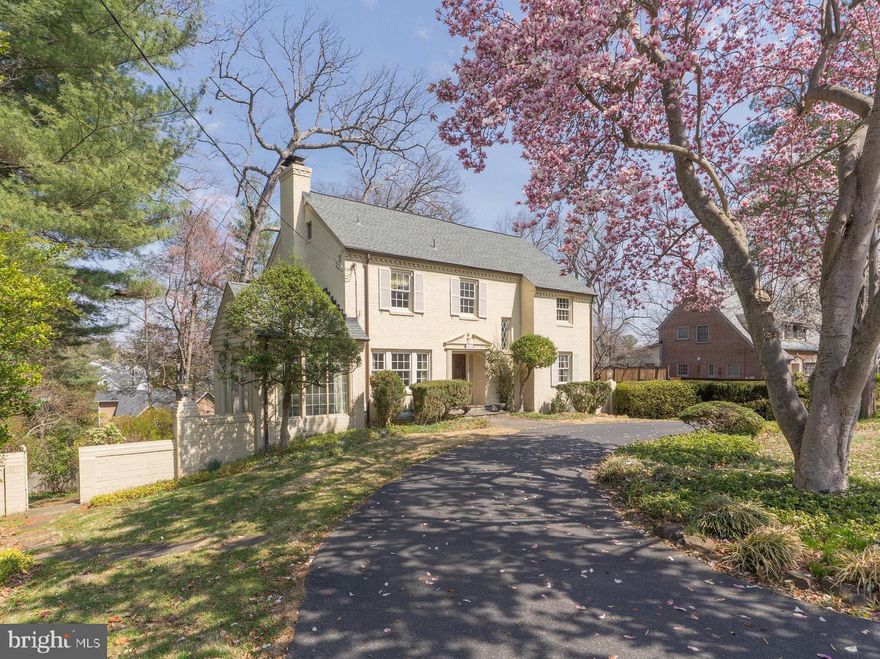 Presenting this charming 1948 Colonial boasting 4 bedrooms, 3.5 baths, and 3,330 interior square feet. Nestled on a lush 0.35-acre lot, this classic home offers timeless architecture, generous living spaces, stunning treetop views, and endless opportunity for customization and modern updates.

Stepping inside, the gracious main level features a formal living room with a fireplace, an adjoining sitting room, and a spacious dining room—each bathed in natural light. The kitchen and breakfast area seamlessly connect to a large rear deck, offering breathtaking panoramic views, ideal for outdoor entertaining or quiet relaxation. A private office and powder room complete the main level.

The upper level hosts a primary suite with a walk-in closet and ensuite bath, along with two additional generously sized bedrooms and a shared bath. Above, the unfinished attic level offers 965 square feet of storage or potential expansion possibilities.

The walkout lower level provides additional flexibility, featuring a large recreation room, a cozy family room with a wet bar, a fourth bedroom, and a full bath—perfect for guests or extended family. The home also includes a laundry/mechanical room, garage, and a covered carport for added convenience.

With classic Colonial charm, a prime location, and an abundance of space, this home presents an exciting opportunity to reimagine and personalize a Bethesda gem. Enjoy the best of both worlds—peaceful surroundings with easy access to downtown Bethesda, top-rated schools, shopping, dining, and major commuter routes.