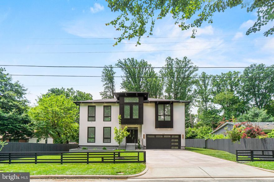 Welcome to Falls Church—one of Fairfax’s most established and sought-after cities, celebrated for its tree-lined streets, warm sense of community, and unbeatable convenience. Ideally located near local family-owned stores, acclaimed restaurants, and highly coveted public and private schools, this setting offers a perfect balance of private sanctuary and everyday accessibility.
Introducing The Obsidian, an extraordinary "2-years-new" contemporary estate where architectural sophistication meets modern comfort across more than 7,400 square feet of impeccably designed living space. Nestled on a fully fenced lot, this custom masterpiece goes far beyond standard builder-grade, showcasing a platinum package of premium finishes, thoughtful craftsmanship, and elevated luxury.
A dramatic grand foyer welcomes you with designer lighting, stunning oak hardwood floors, and soaring 10’4” ceilings paired with 8’ doors.  A statement in both form and function, outfitted with custom cabinetry up to the ceiling, a professional-grade hood, Cosentino quartz countertops, and a striking quartz island with seating. The premium Thermador stainless-steel appliance package includes a 48” gas range.  The open-concept design flows effortlessly into the expansive family room, anchored by custom built-in shelving and a sleek stone gas fireplace. A formal dining room offers an elegant space for hosting.  A dedicated mudroom features built-in lockers and cubbies, while a private main-level guest suite with an en-suite bath provides exceptional flexibility for multigenerational living or a sophisticated home office.
The Upper-Level Retreat has been designed for relaxation with 10’4” ceilings and hardwood flooring through the hallways and bedrooms, two distinct sitting areas and a dedicated laundry room with cabinetry, sink and pet shower.  The owner's suite is a true retreat featuring a cozy gas fireplace, an oversized walk-in closet, and a spa-inspired bath and private access to the 200+ sqft deck. 
Three additional spacious bedrooms are located on this level, each offering the privacy of its own en-suite bath.  The fully finished lower level expands your lifestyle and entertaining possibilities. It features a sprawling recreation room, an oversized wet bar, a dedicated Exercise Room, and two additional bedrooms with one-and-a-half baths, perfect for hosting gatherings or extended stays.  Designed for seamless indoor-outdoor entertaining, the main level connects effortlessly to a special porch and a spacious deck overlooking the fenced backyard.
Built with Avalon Quality, this home is crafted for long-term peace of mind. Premium construction features include upgraded 2x6 framing and superior foam r-19 insulation throughout the entire home,  advanced ION communicating HVAC system, high efficiency water heater, temperature conditioned foam insulated attic, whole-house ventilation, humidifier, and electronic air cleaner,  integrated surround sound, abundant recessed lighting, and two-car garage with ample storage space.   
Far from a standard build, this residence is a true architectural statement. Every element—from the curated materials to the intentional floor plan—was selected for immediate visual impact and generational longevity.