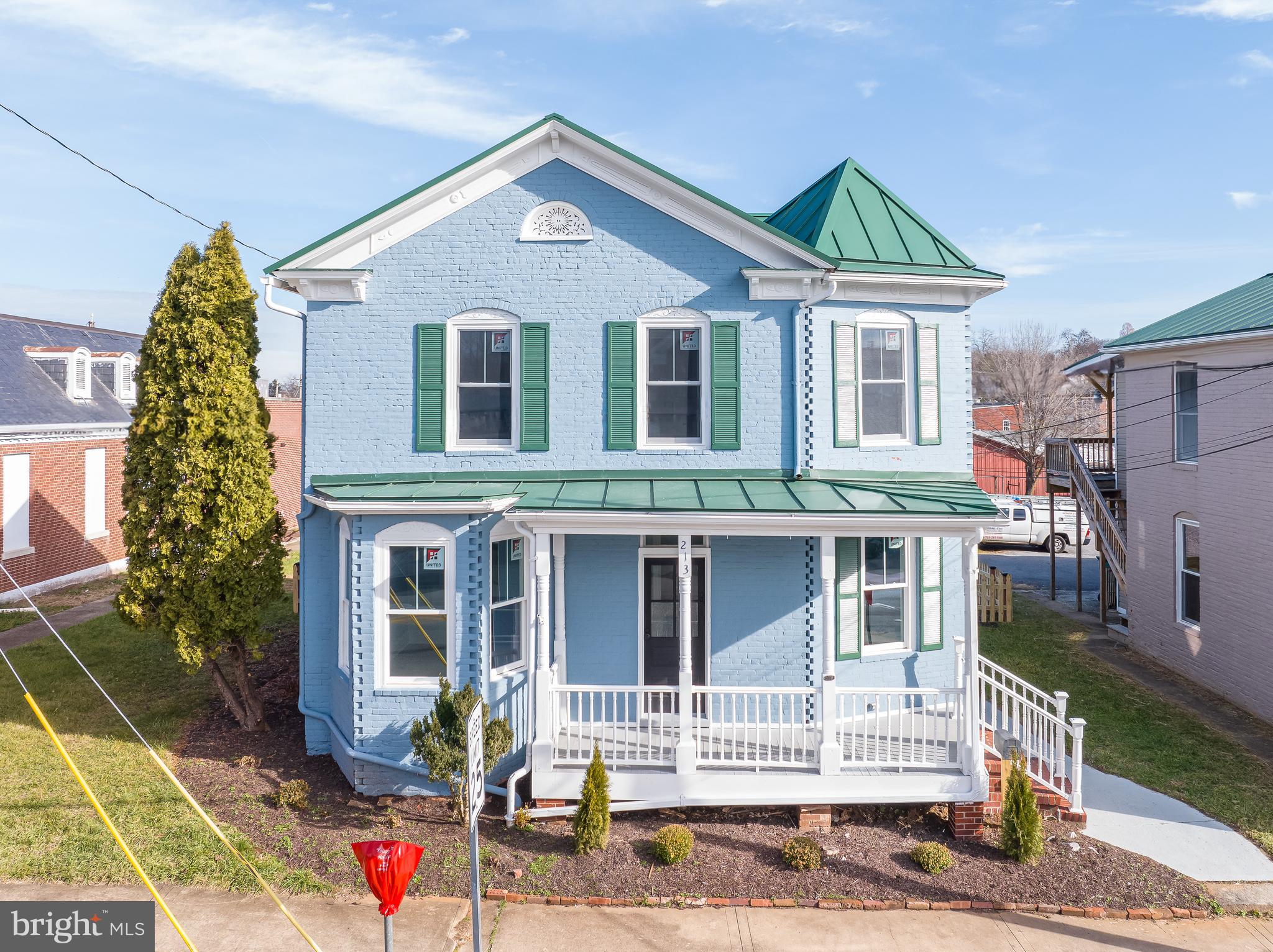Discover a rare opportunity to own a piece of Charles Town history with this beautifully renovated 1885-built home, where timeless architecture meets modern updates. This charming two-story property offers 2,128 square feet of versatile space with three spacious bedrooms, two full bathrooms, and zoning that allows for both residential and commercial use - at one time it served as a law office. Inside, the home seamlessly blends classic character with thoughtful upgrades. Enjoy new Luxury Vinyl Plank (LVP) flooring, energy-efficient windows, LED lighting, heat pump system, and a durable metal roof. The stylish kitchen features granite countertops and ample cabinetry—perfect for everyday living or a hospitality setting. Whether you're looking for a distinctive primary residence, a live/work setup, or a boutique professional space, this property adapts to your vision. Its prominent road frontage in the heart of town ensures visibility and accessibility, while the rare 10-car private parking lot in the rear offers convenience rarely found in town. Two storage buildings and a fully fenced backyard enhance functionality. The 0.20-acre lot also includes additional space beyond the parking area, providing potential for future expansion, outdoor seating, lawn or garden space. With walkable access to shops, restaurants, and local attractions, the location supports both vibrant living and commercial success. Whether you’re drawn to its historical charm, modern comforts, or business potential, this unique property offers the best of all worlds.