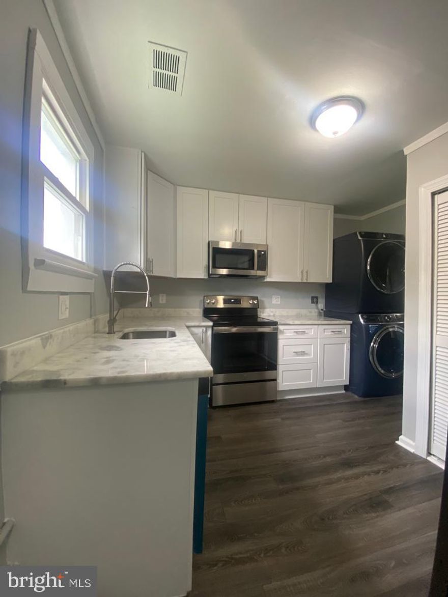 FULLY RENOVATED 2BR/1BA WITH AN UPSTAIRS LOFT WITHIN WALKING DISTANCE OF THE METRO. EVERYTHIN IS BRAND NEW!! NEW WOOD FLOORS, NEW WHITE SHAKER CABINETS, NEW STONE COUNTERS, NEW DESIGNER TILE, NEW CARPET, NEW SS APPLIANCES, NEW WASHER DRYER, & FRESH PAINT. MOVE IN READY! MUST SEE PICTURES!