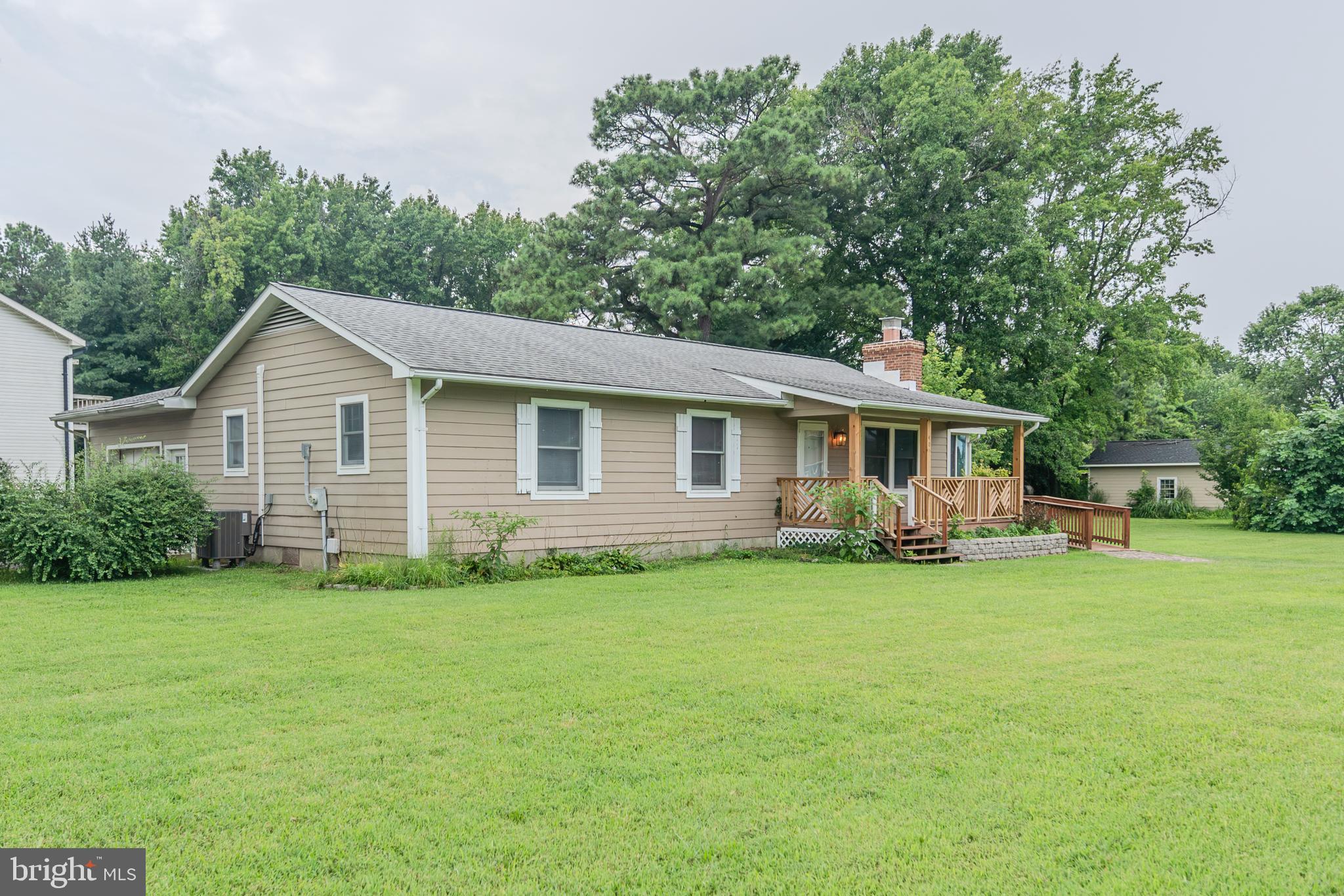 Charming home in a water-oriented neighborhood. Three beds, 2 baths, a cozy sun room, fireplace (recently repaired and serviced), and large deck for gatherings, and so much more. Nicely situated on a corner lot. Garage and shed for tons of storage.