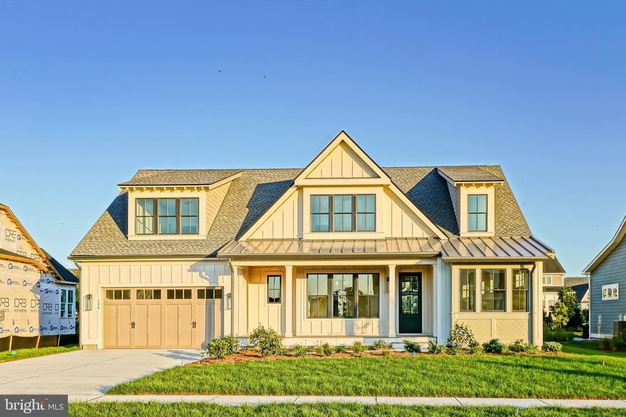 CUSTOM PERFECTION!  NEW CONSTRUCTION! This masterpiece, designed and built by the highly respected Lewes Building Company, is in the heart of Lewes’ newest luxury home community: Olde Town. Set on a very generous 75' x 135' (10,125 sq ft) homesite, the charming exterior boasts classic coastal design elements including lap siding, rafter tails and a welcoming front porch.  From the moment you enter, this home impresses you with its understated elegance and custom features, like wainscoting in the foyer and a coffered ceiling in the living room. This 2-story home with a finished basement offers just under 5,500 square feet of living space on 3 levels. Designed for the multi-faceted needs of how we live and entertain today, the main level offers a bright, open living room that flows seamlessly into a gourmet kitchen featuring Monogram appliances. A sunny breakfast area overlooking the back yard is the perfect place for a quick bite in the morning, while the separate dining room provides space for more formal gatherings. The adjoining scullery tucked behind the main kitchen serves as a pantry and a wonderful place for a coffee station.   The main level also includes a guest bedroom, full bath, primary suite, laundry room and mudroom entry off an attached 2 car garage. Imagine yourself relaxing in the spacious & inviting main level primary bedroom with its spa-like ensuite bath and huge walk-in closets.  While the main floor is set up for easy “one floor living”, this home offers the flexibility and space to host lots of family & friends. There are 4 bedrooms - including 1 ensuite - located on the 2nd level, as well as a second-floor flex room, laundry room, and storage space. The finished basement includes a large family room, full bathroom, bar/kitchenette, and flex spaces which could be used for any number of things (e.g., gym, office, crafts room, or additional bedrooms). The floorplan is as functional as it is beautiful!  The large patio, with a gorgeous stone fireplace, provides the perfect place for outdoor entertaining and al fresco dining. The beautifully landscaped back yard abuts a treed greenspace and common area buffer. And did we mention location?! This home is nestled on a quiet street just a quick walk from the community pool and pool house - providing even more opportunities for relaxation and entertainment. Olde Town is adjacent to the popular Junction & Breakwater Trail for walking/running/biking and the 16-acre White's Pond. It is within walking distance to all of the dining, entertainment & shopping of historic downtown Lewes; is less than 1 mile to the beach; and is an easy bike ride to Cape Henlopen State Park. This thoughtfully designed custom-built home - with 6 bedrooms, 6 bathrooms, flex room spaces and every imaginable upgrade feature - offers you the perfect opportunity, in a prime location, to live your best Lewes Life!