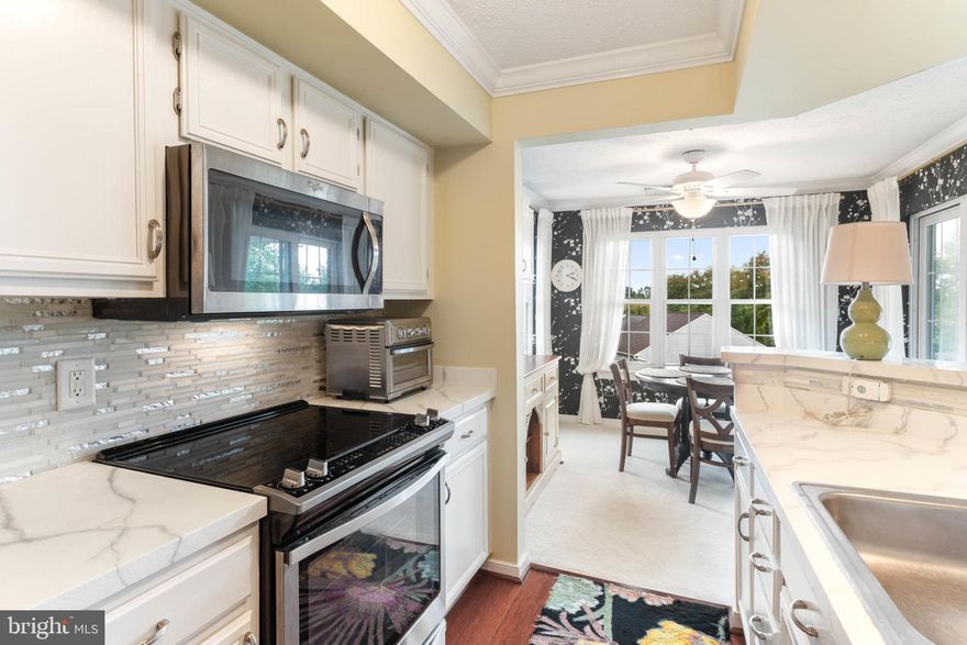 FHA APPROVED!!! Beautiful 3rd floor condo with 3 cozy bedrooms and 2 elegant full baths JUST REDUCED IN PRICE!!! This home includes a renovated kitchen w/ SS appliance, 5-year-old central air unit, new water heater (2 years old), & private balcony for these wonderful autumn evenings. Main bedroom includes cathedral ceiling with walk in closet & bath. Two outside storage units give it plenty of storage space. It's the perfect blend of comfort & convenience! Schedule your appointment today!!! Draperies & some furnishings come with the home, including fireplace & large mirror above.