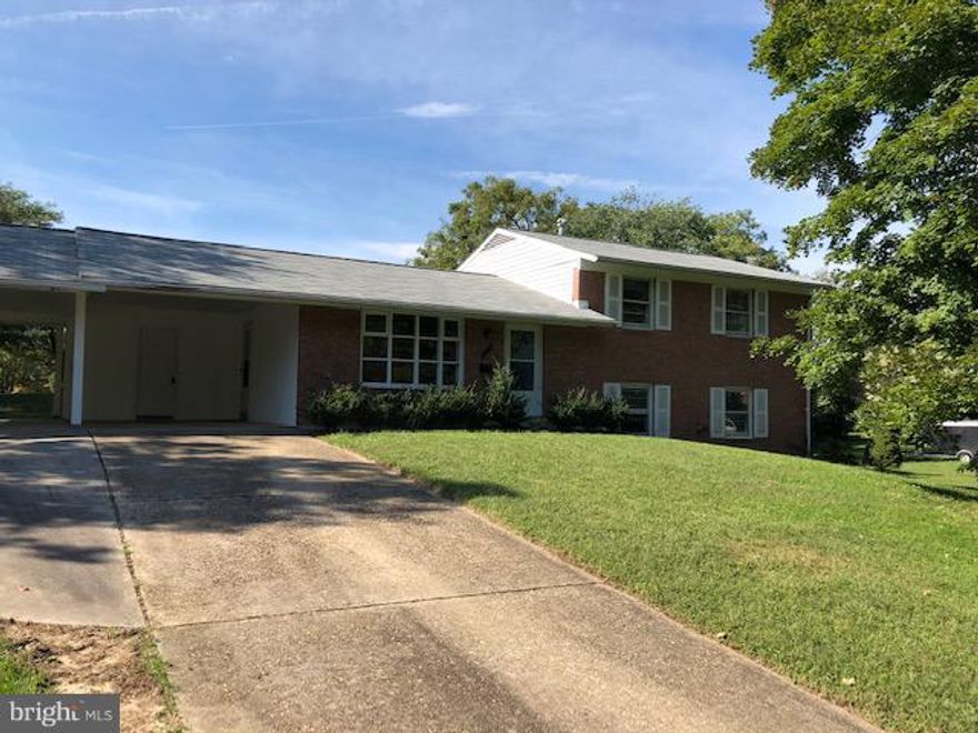 NEW PRICE.. Inviting home with large living room and bay window, dining room and den with fireplace and sliding doors to backyard which is not fenced.  Good size kitchen with side door to the carport.  There is a large storage area in carport.   3 bedrooms and 2 baths up and new floors in Family  room and lower level bedroom with a new bath.  Huge yard on a corner lot. Large driveway and carport.  Close to Pinecrest Park and Braddock Rd & new St James Center.  40 x the rent is income requirement.