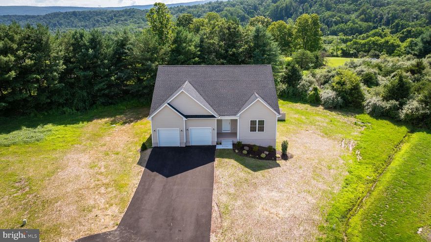 MOTIVATED SELLER *** Welcome home to this beautifully crafted new construction ranch in the sought-after Cacapon South community of Berkeley Springs, WV.    Perfectly positioned at the end of a quiet cul-de-sac, this home offers peaceful mountain views and a seamless blend of modern style and timeless design.
Inside, you’ll find 3 spacious bedrooms, 2 full bathrooms, and a 2-car garage, thoughtfully laid out in an open-concept floor plan ideal for both everyday living and entertaining. Vaulted ceilings, luxury vinyl plank flooring, recessed lighting, and oversized windows fill the home with natural light and an airy feel throughout.
The kitchen is a true focal point, featuring granite countertops, a large center island, soft-close cabinetry, and a generous pantry—perfect for gatherings and daily functionality. The private primary suite offers a relaxing retreat with a walk-in closet, dual vanities, and a beautifully tiled walk-in shower. Two additional bedrooms and a full bath provide flexible space for guests, a home office. 
Downstairs, the full walkout basement with rough-in plumbing offers endless potential for future living space, recreation, or an in-law suite. Outside, enjoy a paved driveway, elegant wainscoting details, quality finishes, and a serene, tree-lined backyard.
Located directly across from Cacapon Resort State Park, you’ll have easy access to hiking, golf, fishing, and year-round outdoor recreation. A fantastic opportunity to own a move-in ready home in one of Berkeley Springs’ most desirable communities. Schedule your showing today!!