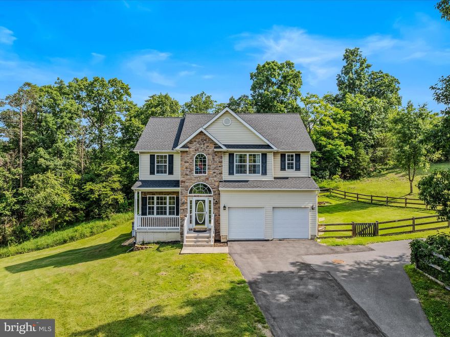 Discover the perfect blend of space, privacy, and convenience in this beautiful colonial home located just a short drive from Winchester, VA—ideal for Northern Virginia commuters seeking a peaceful retreat without sacrificing accessibility. Located in Mills Farm, this home is nestled on a rare 1.13-acre lot that stands out from the rest of the community, offering a more private setting surrounded by natural beauty. Step inside to find an inviting two-story living room filled with natural light, enhanced by soaring windows and a cozy gas fireplace. The spacious kitchen is equipped with brand-new stainless steel appliances and opens to a bright morning room—perfect for casual dining or entertaining. Laminate flooring flows throughout the main level, which also includes a separate formal dining room. Upstairs, the home offers three well-sized bedrooms, including a primary suite with two closets and an updated bathroom featuring a beautifully tiled walk-in shower and a soaking tub. The secondary bedrooms share a convenient Jack and Jill bathroom, ideal for practical living. The full walkout basement offers endless potential and opens to a private patio area. With over an acre of land and a thoughtfully designed layout, this home provides comfort, privacy, and convenience in one exceptional package. Additional upgrades include new roof within the last 2 years and recently replaced deck board in 2020.  The community offers a tot lot which is a short walk from this property. Schedule your private tour today and see why this home is a standout choice in the area.