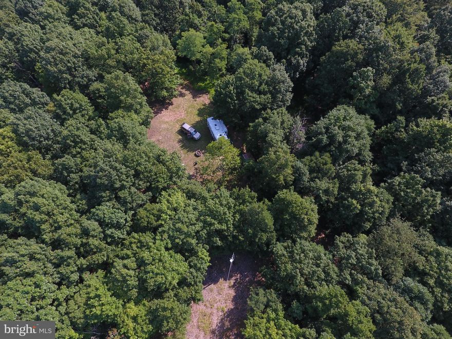 Private 47+ Acre Retreat – Your Dream Escape Awaits! Perfect For: Multi-generational families seeking space to grow together. Outdoor enthusiasts eager for hunting, hiking, or nature immersion. Visionaries ready to build their dream home or expand with additional structures. Seize this chance to own a versatile, private haven with limitless potential. Your escape to freedom and serenity starts here! Unrestricted Freedom: No HOA or limitations—create the retreat you’ve always imagined, whether for hunting, recreation, or peaceful living. This isn’t just a property—it’s a lifestyle sanctuary for hunters, nature lovers, or anyone craving tranquility. Nestled adjacent to Sleepy Creek Wildlife Management Area, offering nearly 23,000 acres of prime hunting access, this retreat provides endless possibilities. Property Highlights: Charming Modular Home: A cozy 3-bedroom, 2-bathroom residence with a detached garage, perfect for immediate move-in or as a base while you build your vision on any of the other lots. Expansive Potential: Four lots ready for additional homes, ideal for multi-generational living or investment opportunities. Infrastructure Ready: Electric, a second well, and a septic system installed on Lot 5 (the top parcel), primed for constructing a cabin, lodge, or your forever home. Note: On the primary residential lot (Lot 3), an ADDITIONAL SEPTIC ALREADY IN PLACE and an additional hookup for electric and well, separate from the primary house/garage. Offering a hookup for a camper or future permanent structure. Property is sold "As-is". Video Surveillance on the property.