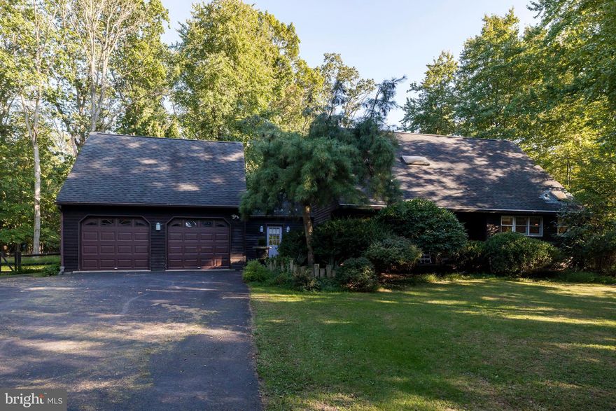 Welcome to this lovely, 3 bedroom, 2 Bathroom, 2 car garage home with finished basement.  Nestled on a beautiful green lot that backs up to woods, it is the epitome of a secluded home in a green sanctuary. Hardwood floors greet you as you enter the home. A sun filled family room with sky lights and sliding deck that walks out to the deck allows for a view of the beautiful backyard.  The family room is equipped with a beautiful stone mantle fireplace,  and walkout to a second deck overlooking the side yard. The main level is also complete with an owners suite with walk-in closet,  and full bathroom with standing shower. A spacious kitchen with stove, oven, refrigerator, and breakfast bar.  2 additional bedrooms upstairs with full bath in the 2nd bedroom. Full finished basement downstairs. Located close to shopping, amenities, and convenient access to highways.