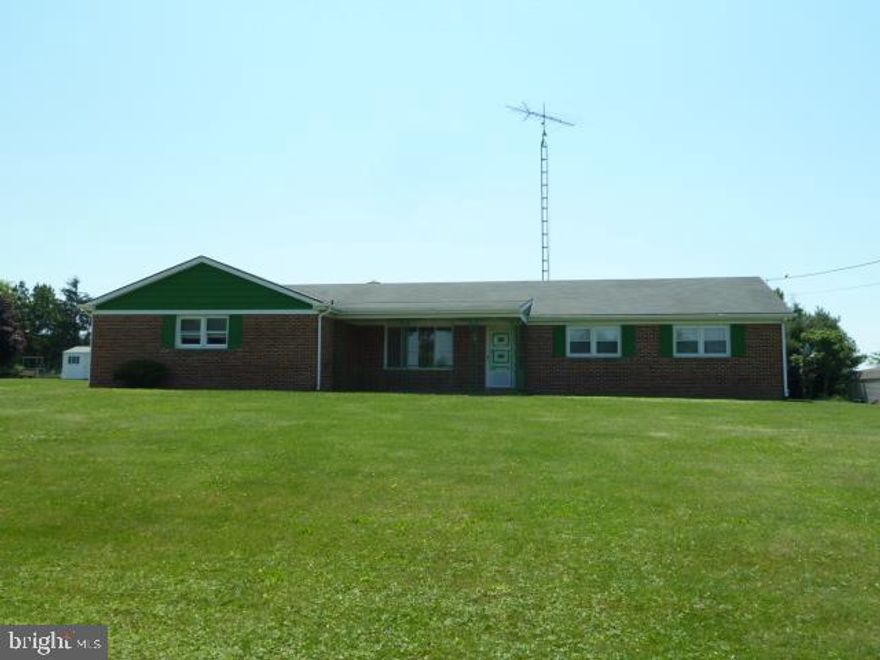 Check out the awesome lot that comes with this 3BR, 2.5BA brick rancher. Over 1.61 acres and level...just think of the possibilities! Large covered front porch, hardwood floors, replacement windows, large eat-in kit, 1st flr family rm with brick fireplace, walk-up attic, unfinished lower for future expansion, cold cellar, 2-car garage, shed and covered patio.