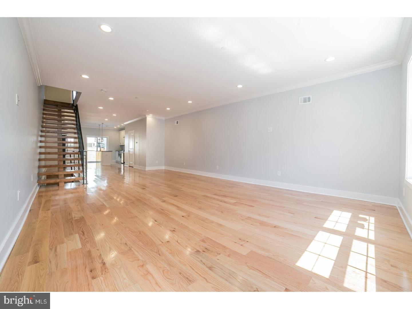 This carefully crafted new construction home located on a quiet street in Fishtown is NOW available! This 3200+ sq. ft. home consists of 4 bedrooms, 4.5 baths with a guest suite in the lower level and bonus room. The first look as you enter the home is the thoughtfully designed floating oak stair case that offers a true feel of an open-floor concept. This level features a modern designed eat-in kitchen with shaker cabinets, stainless steel appliances, a built-in pantry with additional counter space, kitchen island with over pendant lighting and Smart Nest thermostat for easy temperature control. The kitchen leads out to a walk out paver patio with a complete fenced in yard great for private gatherings. The second floor level includes two large bedrooms each one with its own private bathroom. The third level features an additional bedroom as the spacious master suite follow by a custom design barn door a walk-in closet with custom built shelving. The master bath includes a double vanity, walk-in shower, Jacuzzi tub and laundry shoot to your laundry room. This level also has a wet bar with wine cooler, microwave and rustic shelving. The fourth level of this already impressive home boats a massive roof deck with unobstructed 360 degree views of the city. Home has a 10 Year Tax Abatement with a great location: 5 minute walk to the train which is convenient to get to Center City and a 5 minute drive to the Interstate 95. Also only minutes away Frankford Ave with many cafes, restaurants and bars. Schedule an appointment today!