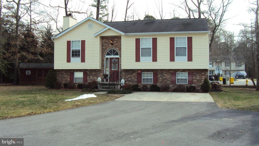 Open floor plan with vaulted ceilings in KIT,DR,LR and MBR.Updated kit with stainless appliances, quartz counters and wood floors.  Roomy L shaped FR with lg windows, FP and full bath. Large unfinished area for storage. 20x16 deck off the kitchen which leads down to a 16x8 lower level.Pets case by case.No fence. EMAIL AGENT FOR QUALIFYING GUIDELINES