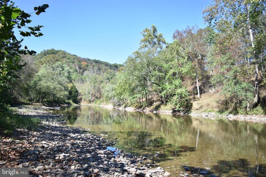Private lots along the Cacapon River. Come enjoy your vacation spot, camp out, or build up out of the flood zone. Disbanded HOA so you can do what you want!