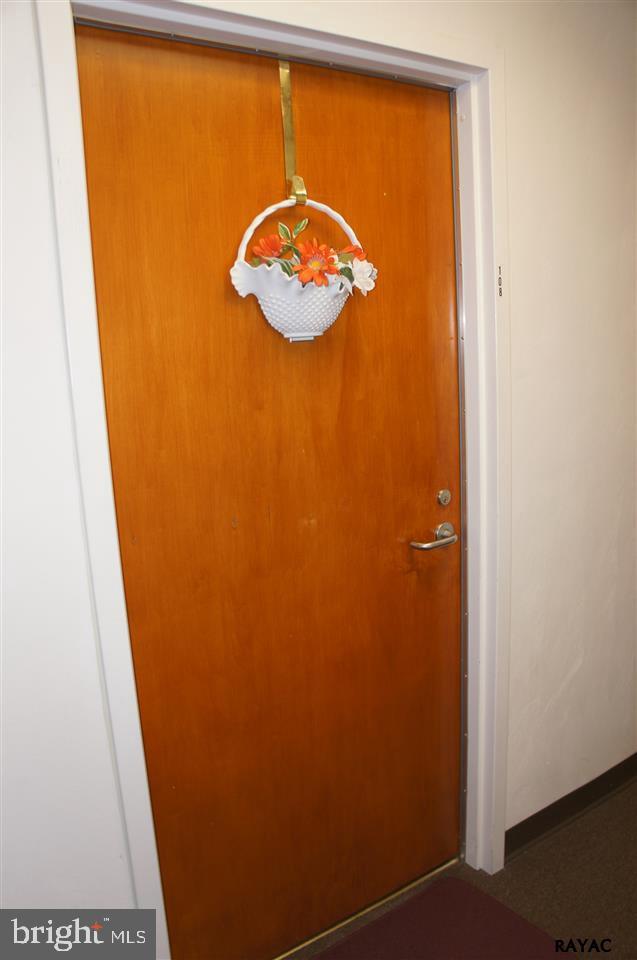 Affordable, Secure, First Floor Living. Live privately or enjoy others in the large gathering/party room. NEW refrigerator. NEW hot water heater. Upgraded heating/cooling system. Upgraded bathroom. Laundry/Storage room. All exterior maintenance, including roof, snow removal, lawn care, provided by the Condominium Association. Move in ready.