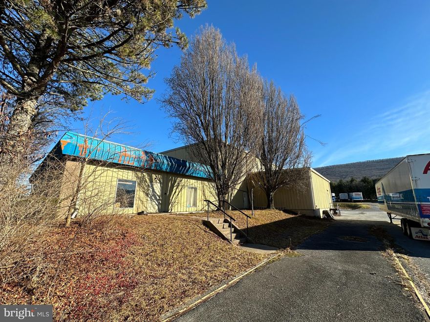 FOR COMP PURPOSES ONLY. Approximately 15,000 square feet of warehouse space with three separate loading docks and a ceiling height of 26 feet are housed in this commercial building. More than 2400 square feet of office space, along with a walk-in safe (whose lock nobody knows), kitchen, restrooms, driver's lounge, and storage. 2.2 acres with convenient access to downtown State College, Bellefonte and I99.